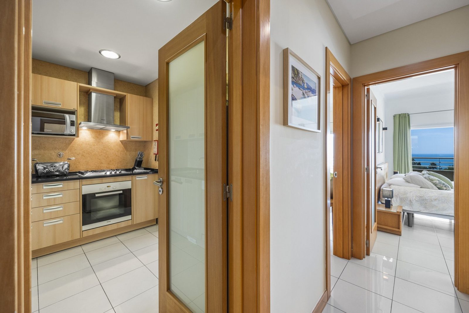 Kitchen with hallway and bedroom view