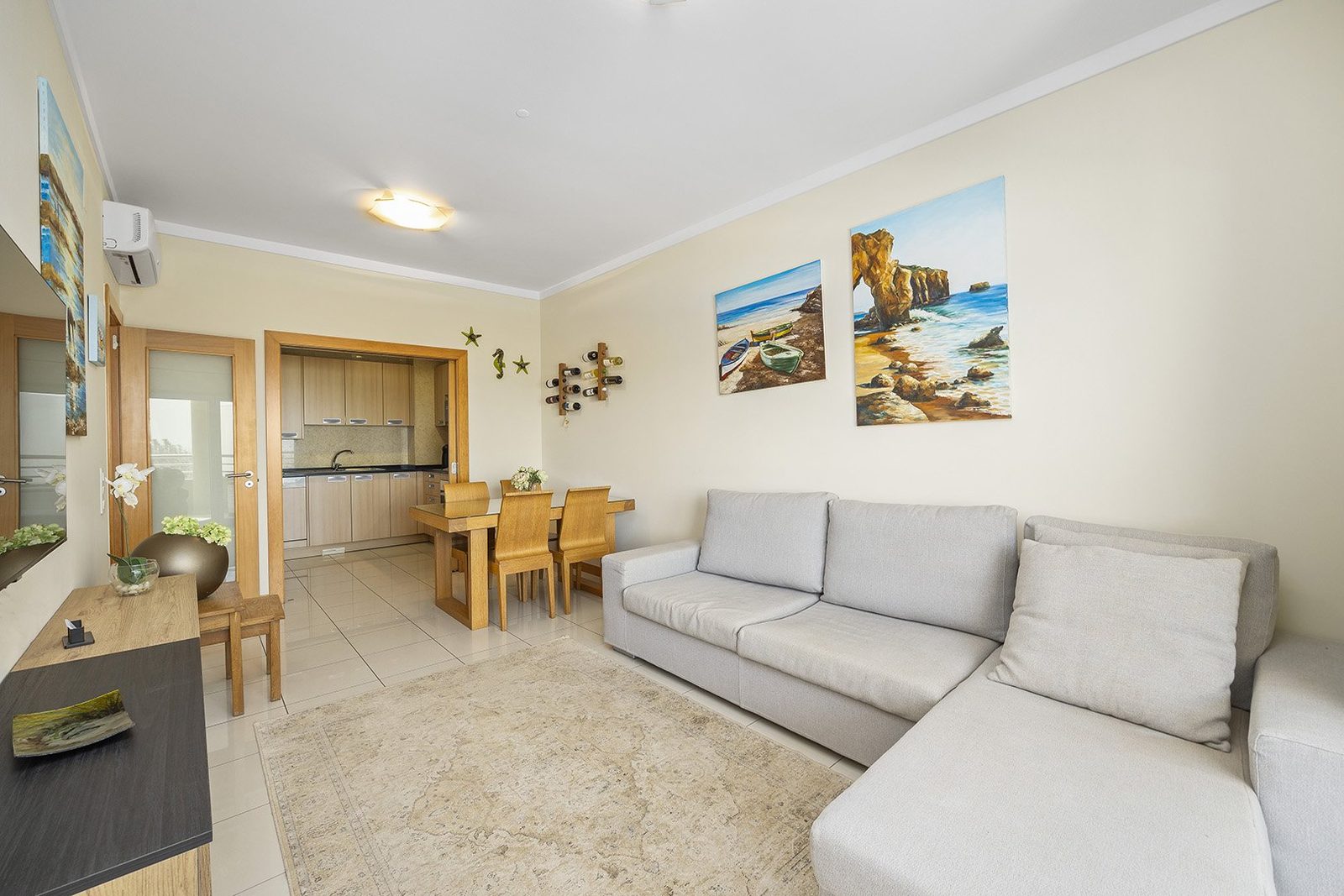 Living room with sofa and view through to the kitchen
