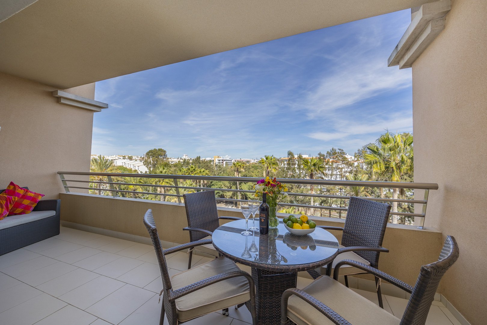 Balcony dining table with wide view over the grounds and coastline