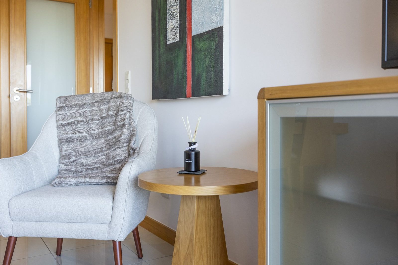 Armchair and side table detail in the living room