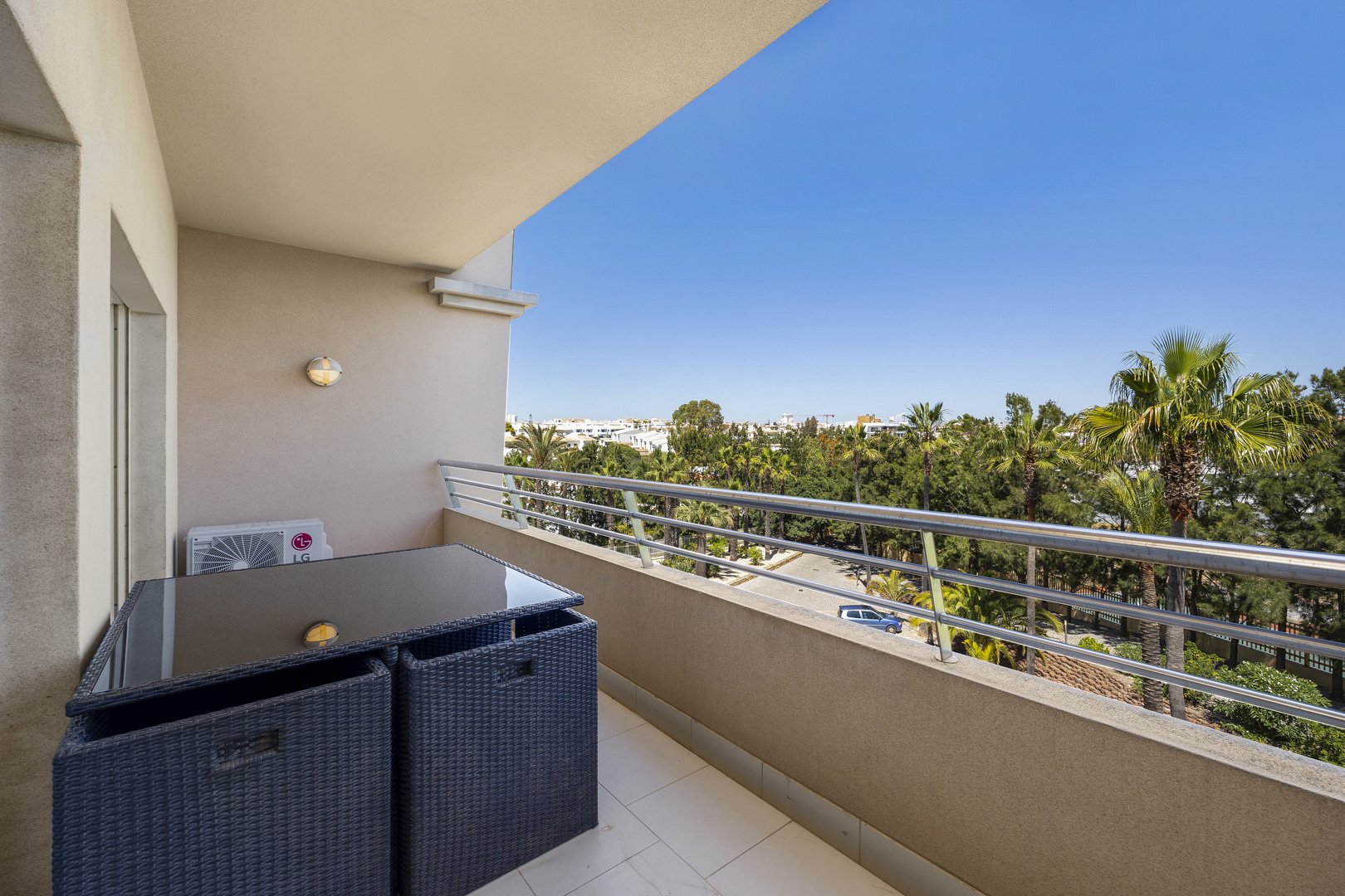 Balcony seating area with treed view