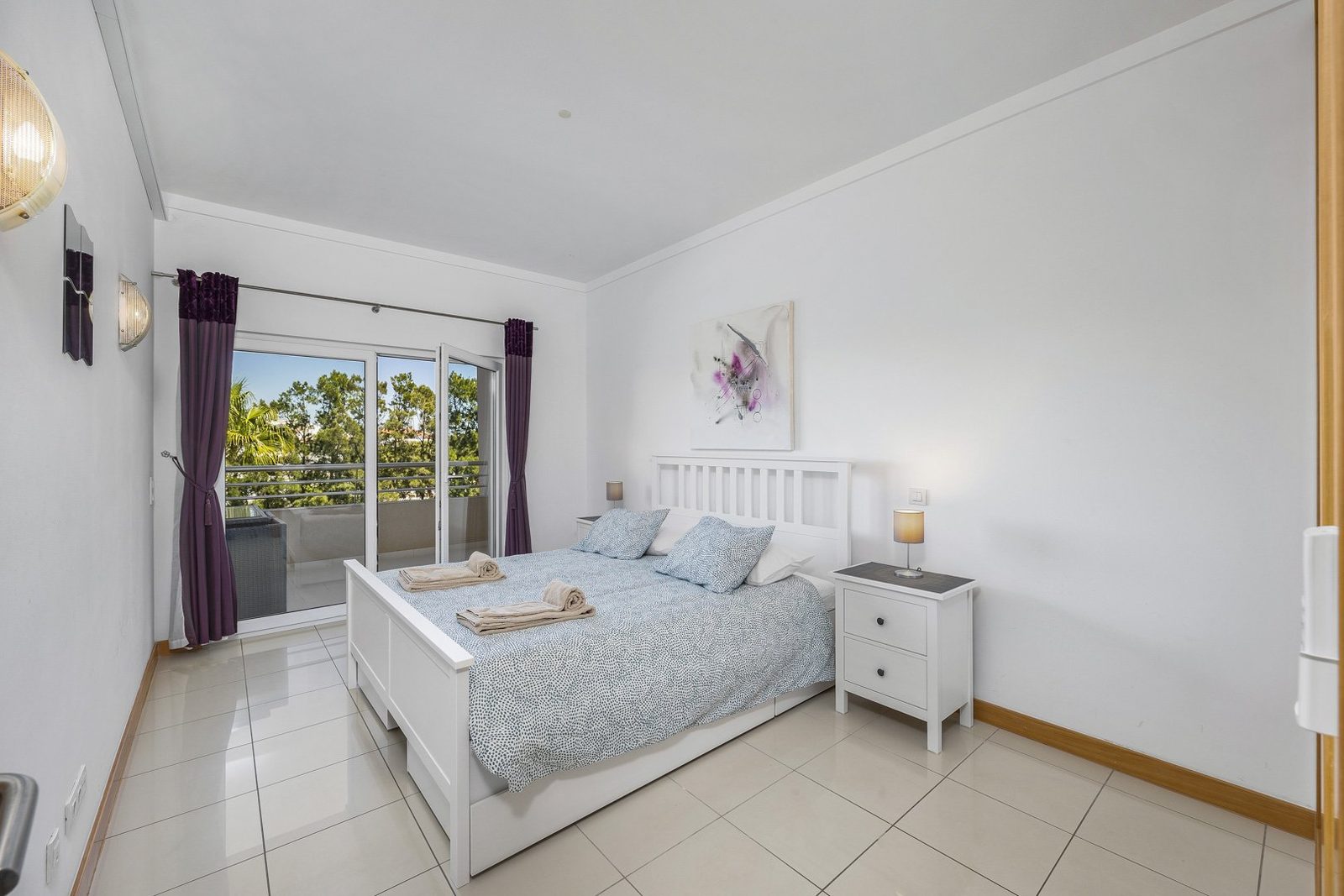 Bedroom with double bed and balcony access