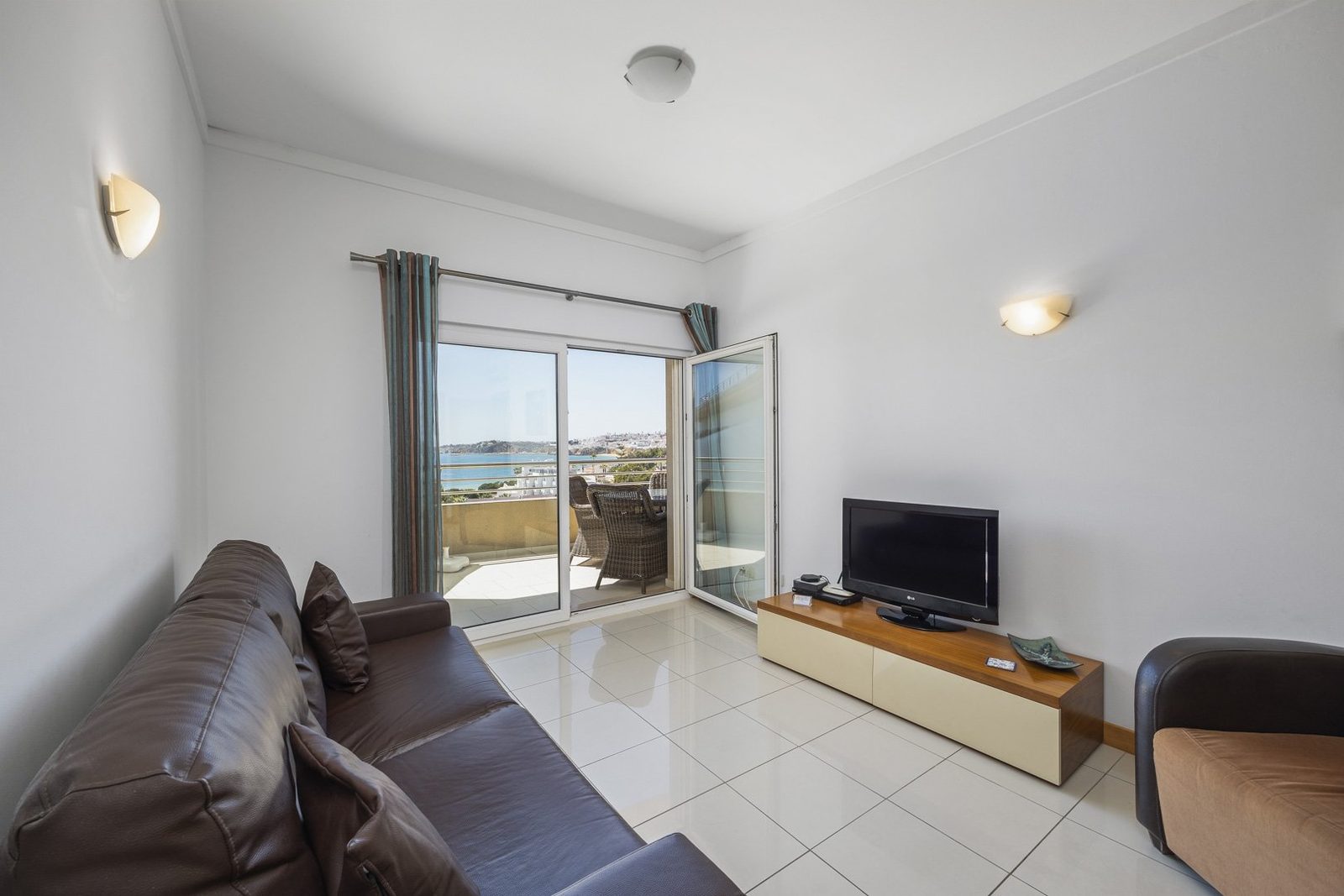 Balcony dining table and chairs with sea view