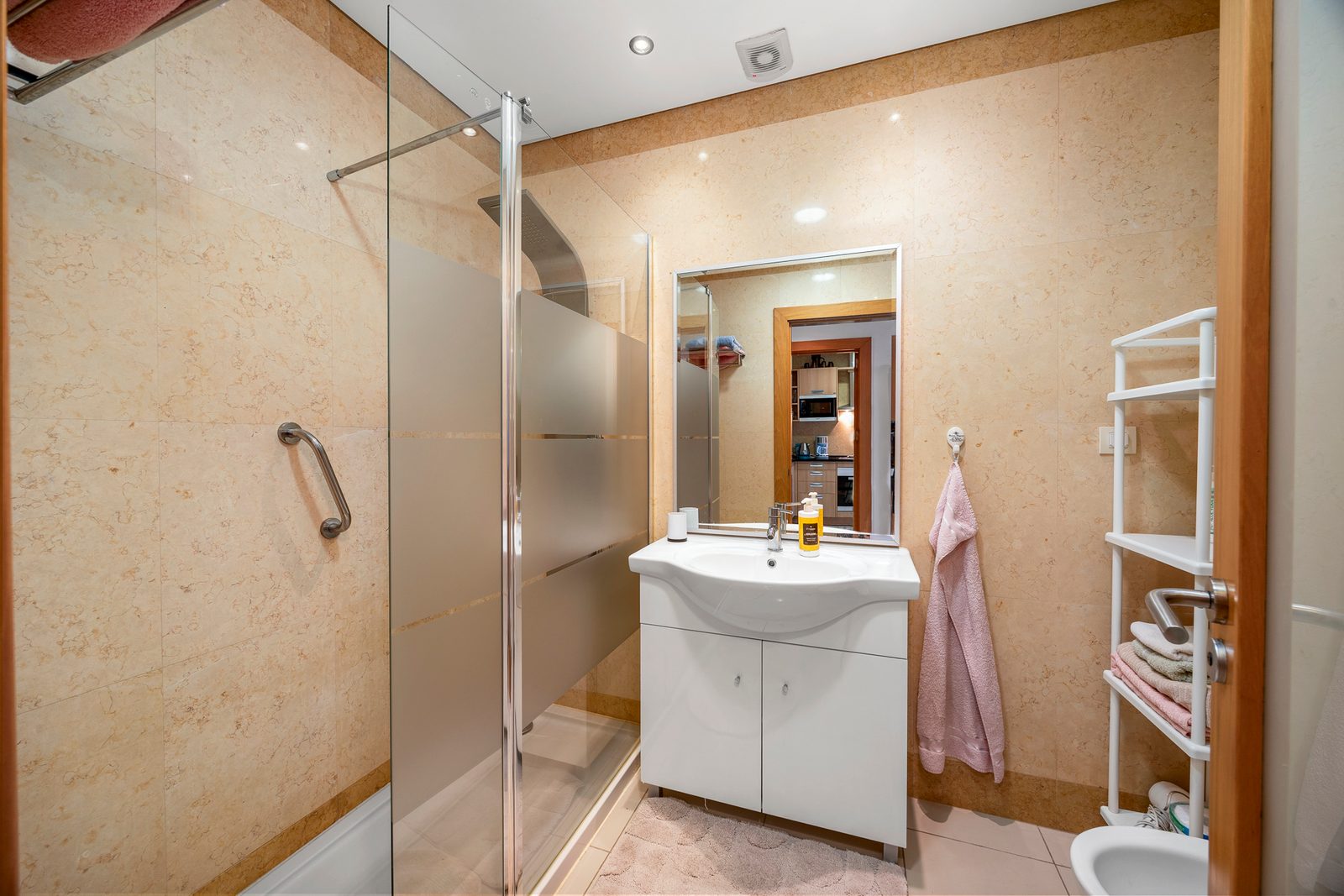 Bathroom with walk-in shower and vanity unit