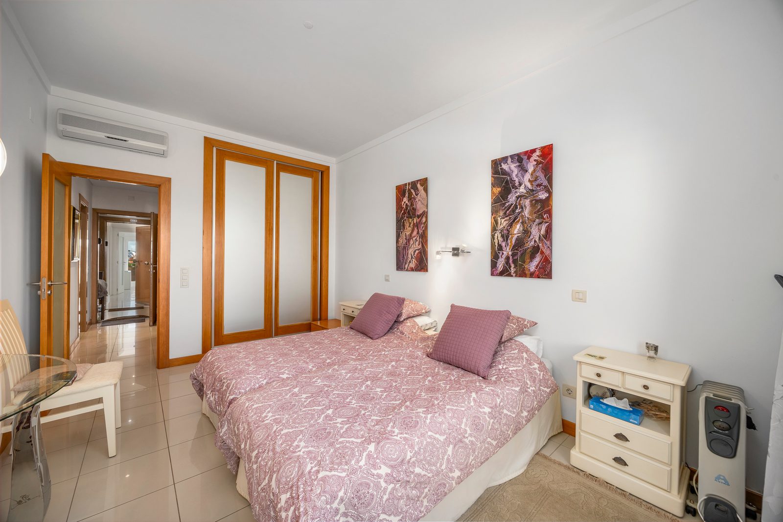 Twin bedroom with fitted wardrobe and air conditioning