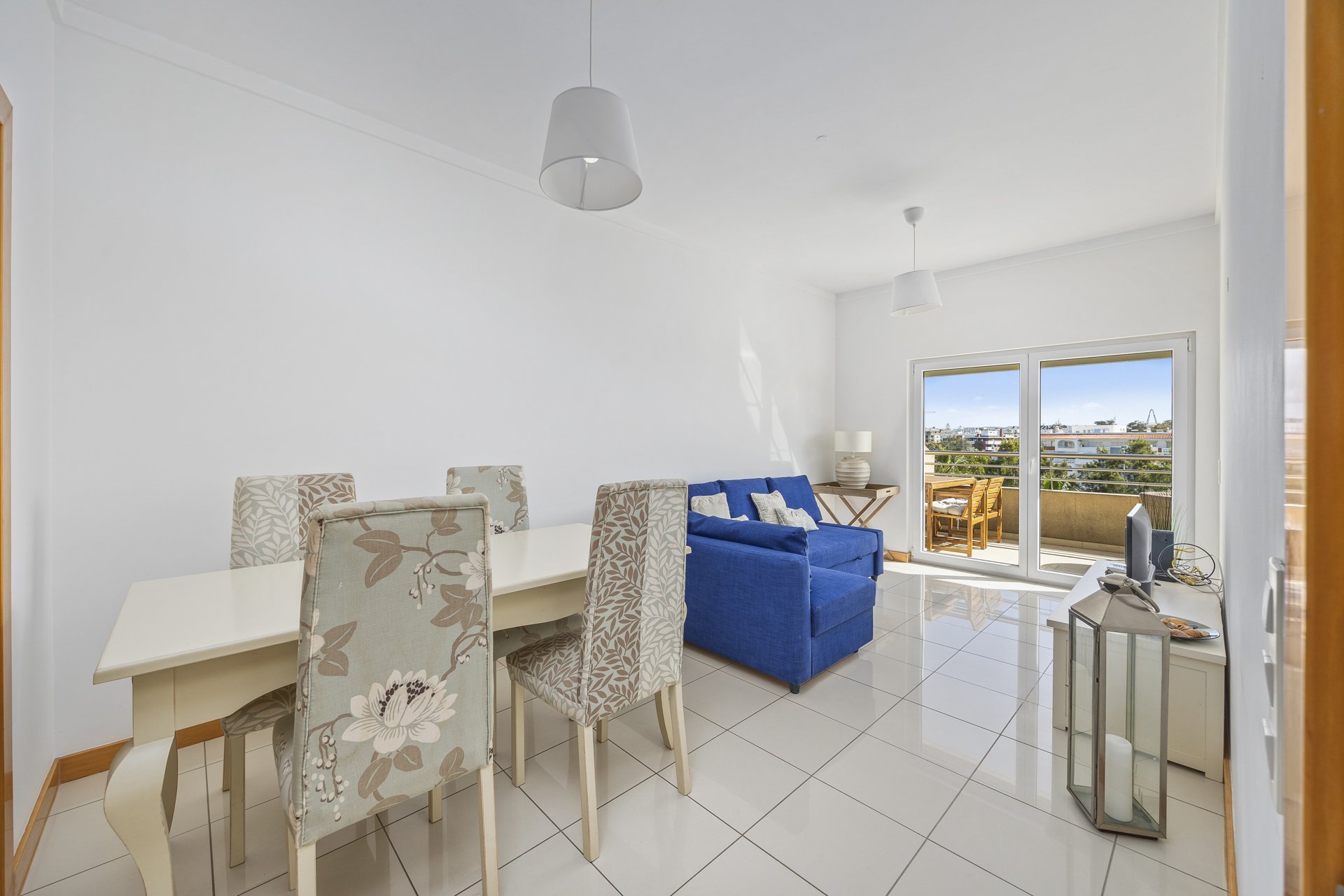 Dining area with table, chairs, and sofa