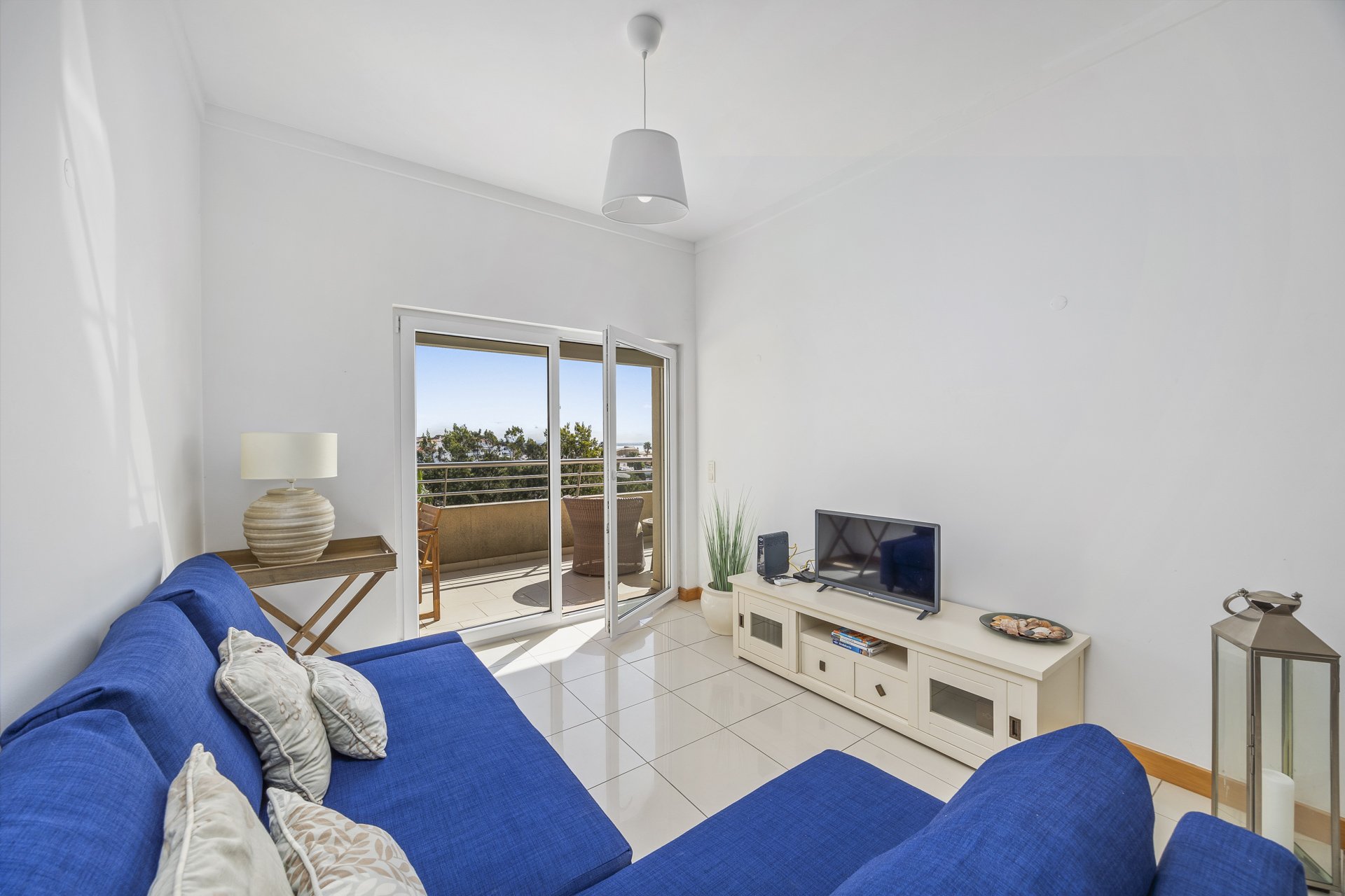 Living room with sofa and balcony doors
