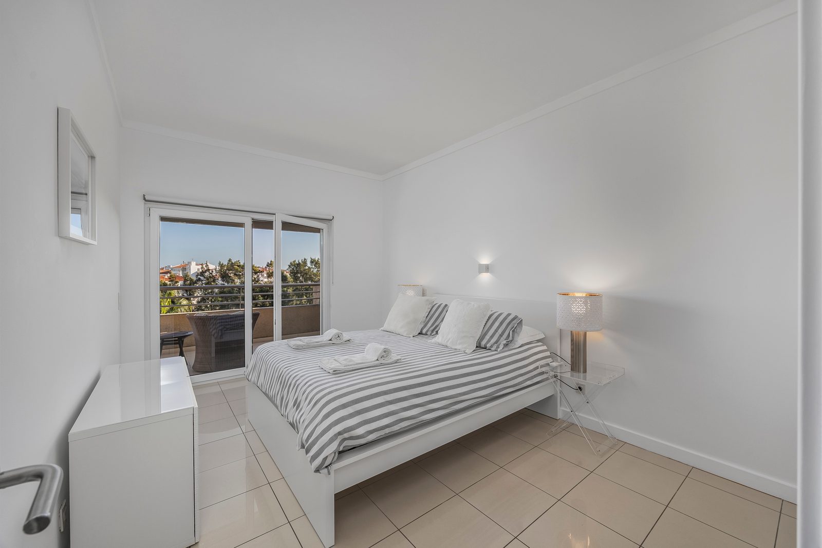 Bedroom with double bed and balcony access