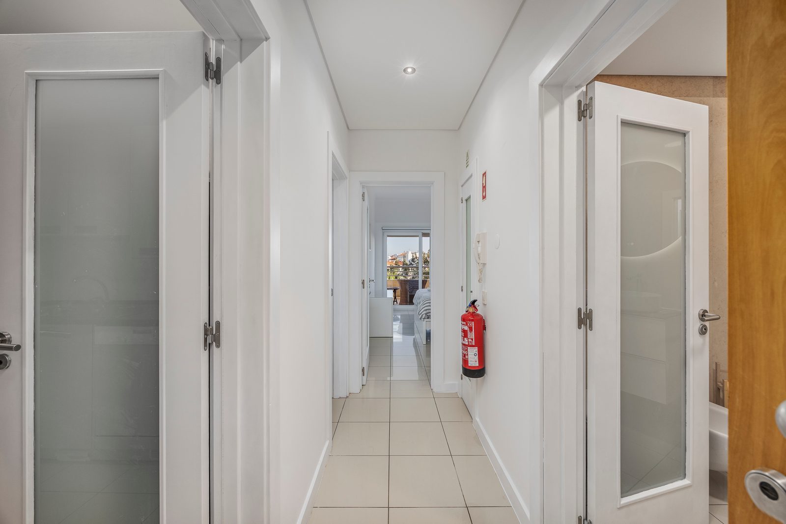 Hallway leading to the living room and balcony