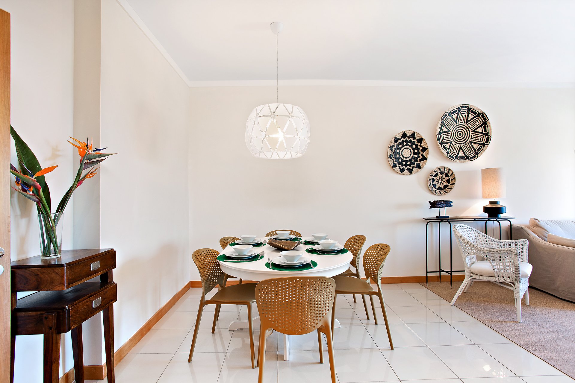 Dining area with decorative wall plates and flowers