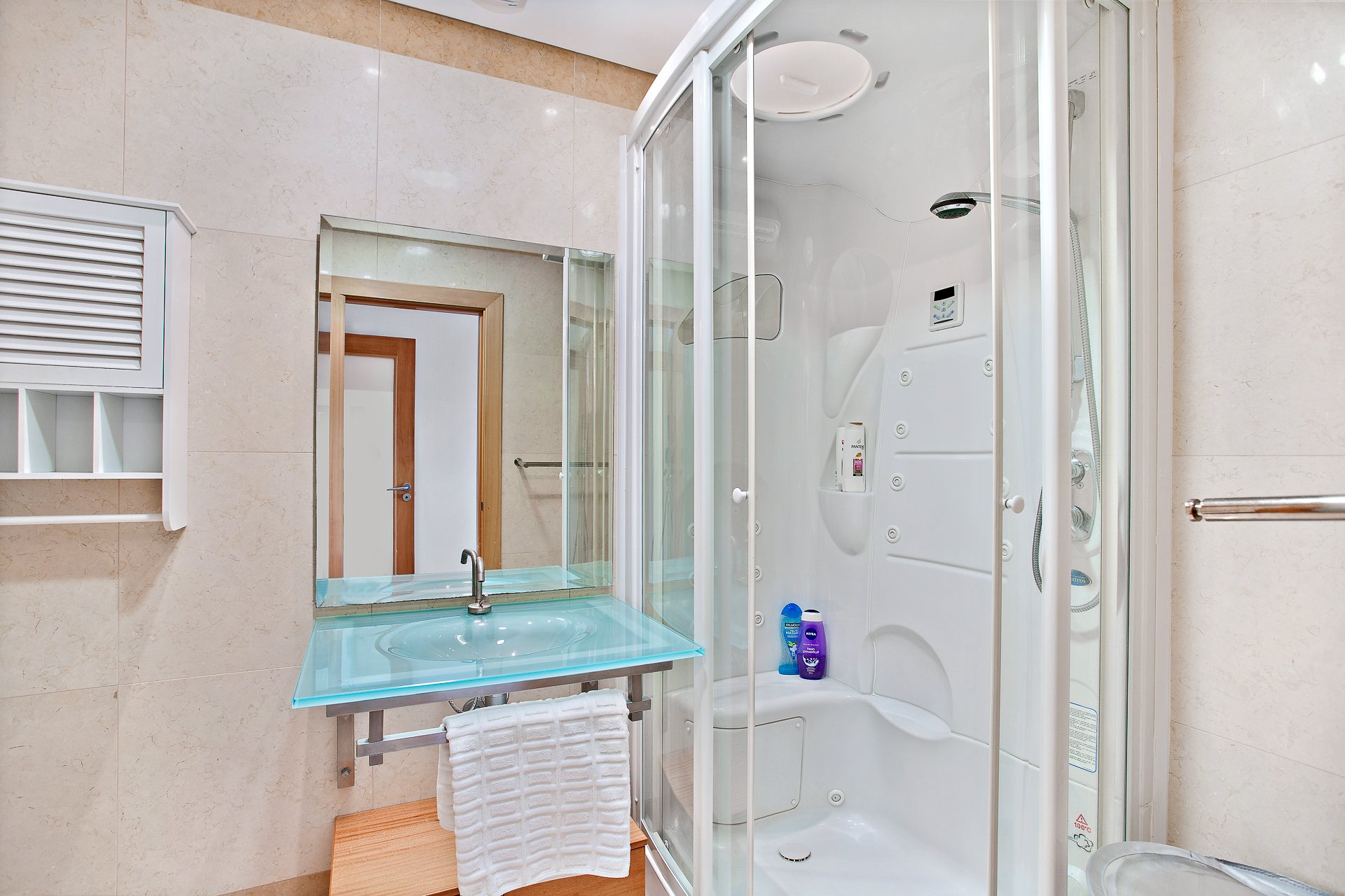 Shower room with corner cubicle and vanity sink