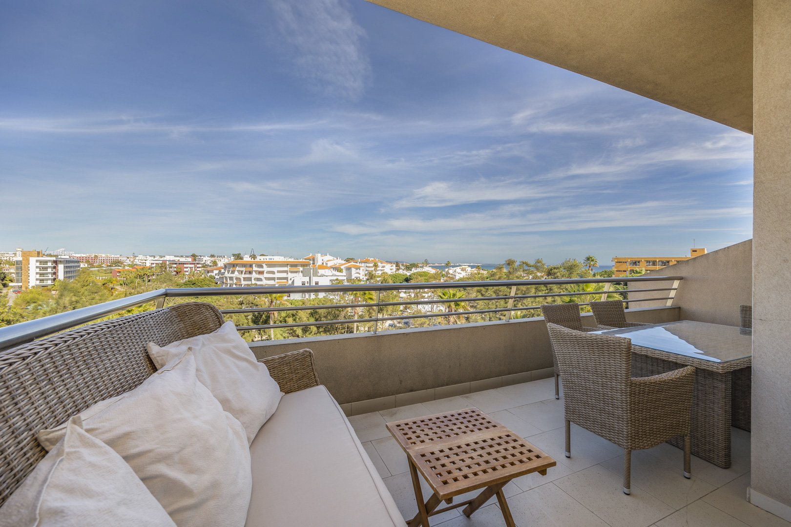 Balcony with cushioned seating and panoramic view over the town