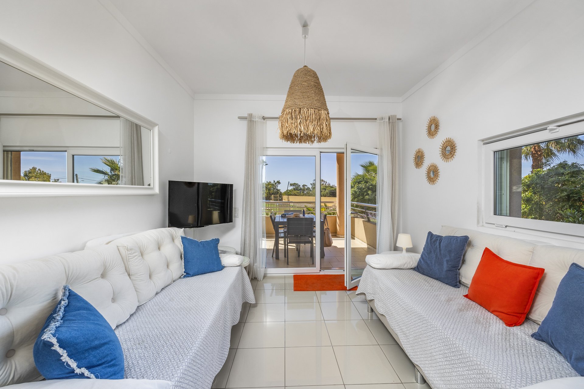 Living room with two sofas facing the balcony