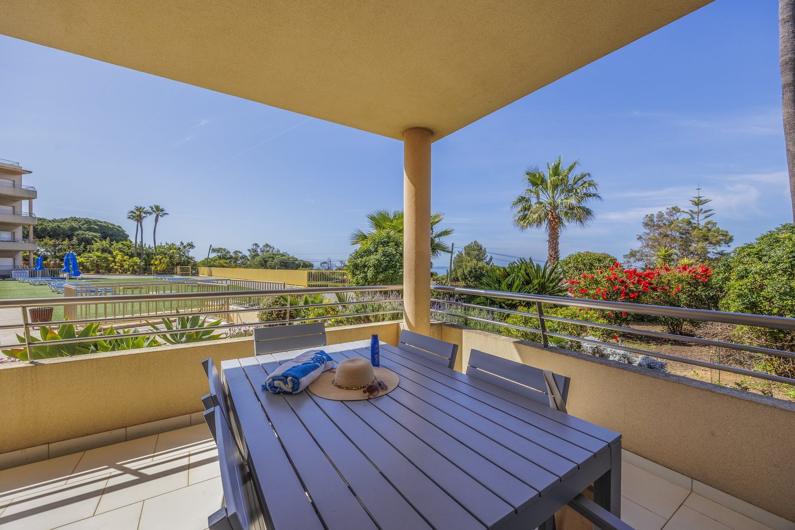 Balcony dining table with sea and coastal view