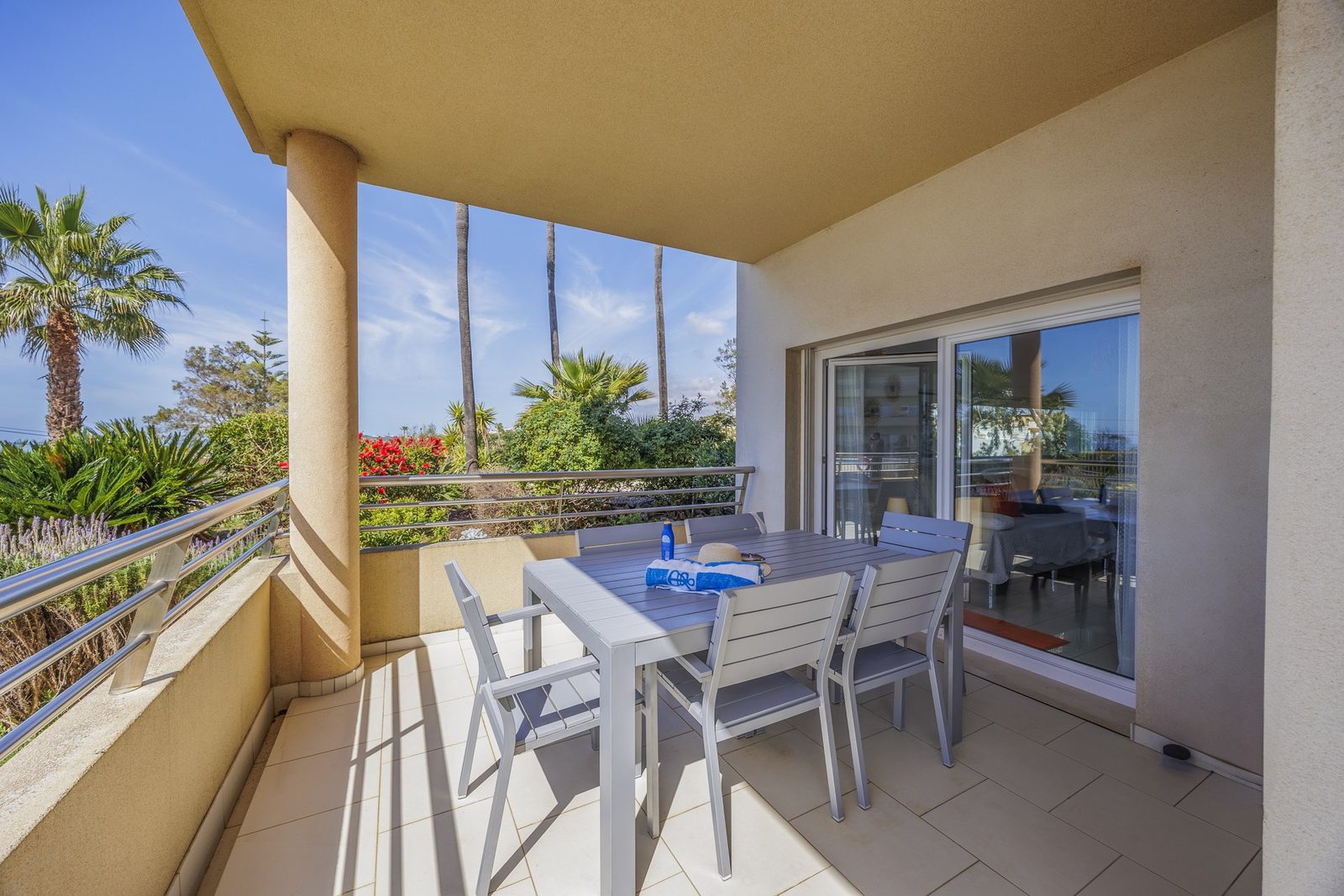 Balcony dining table with view through to the living room