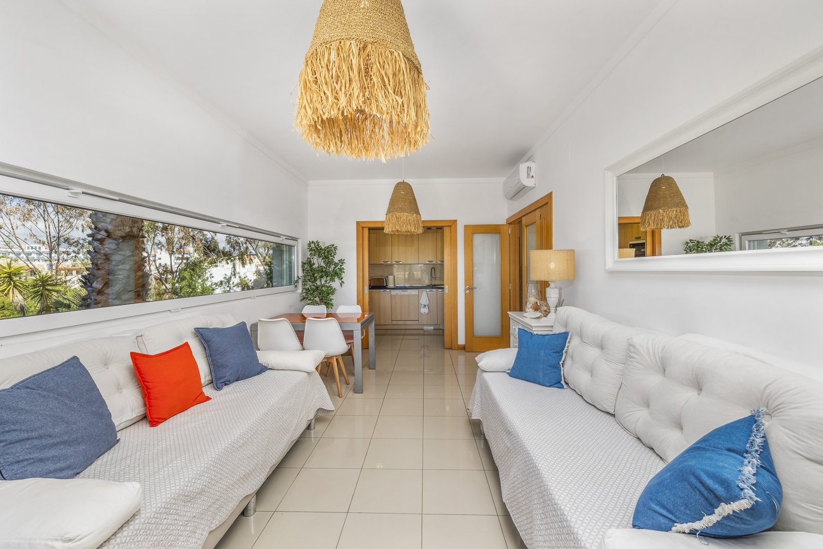 Living area with a deep view through to the dining area and kitchen
