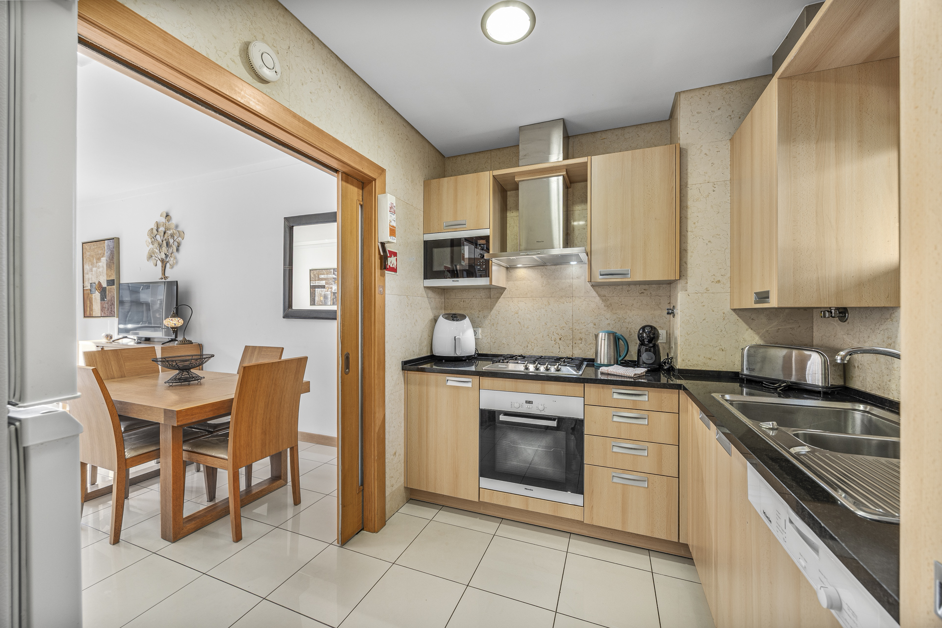 Kitchen with a view through to the dining table