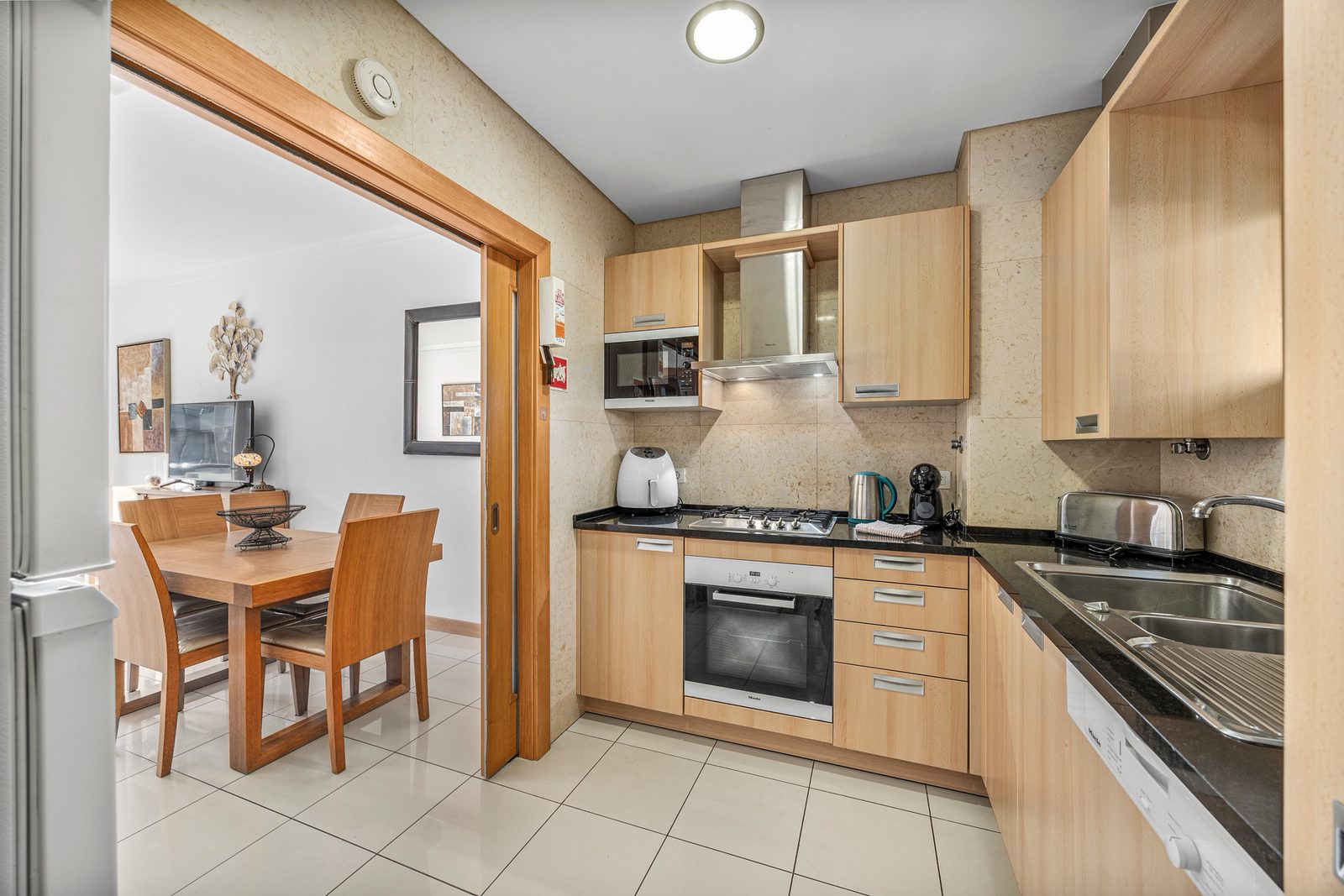 Kitchen with a view through to the dining table