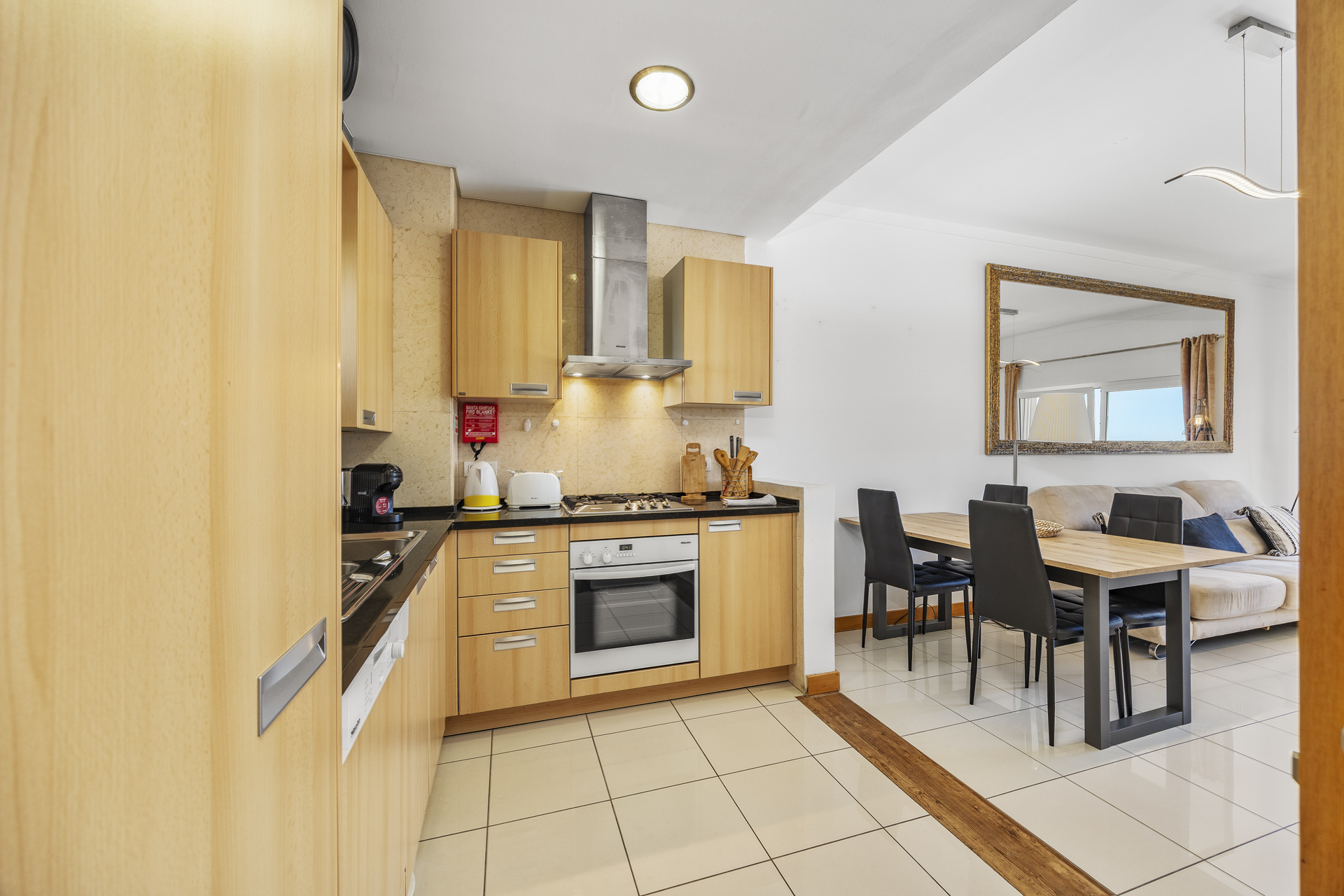 Kitchen with a view through to the dining table
