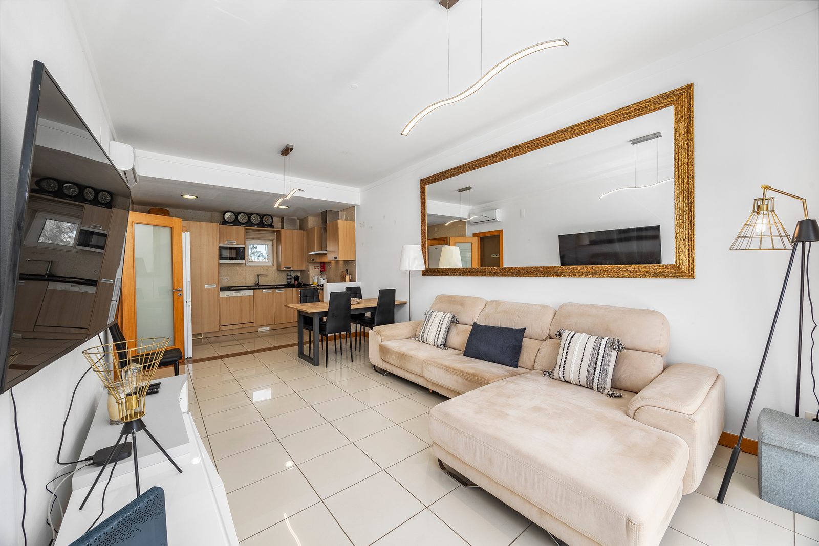 Open-plan living area with a view through to the kitchen and dining space