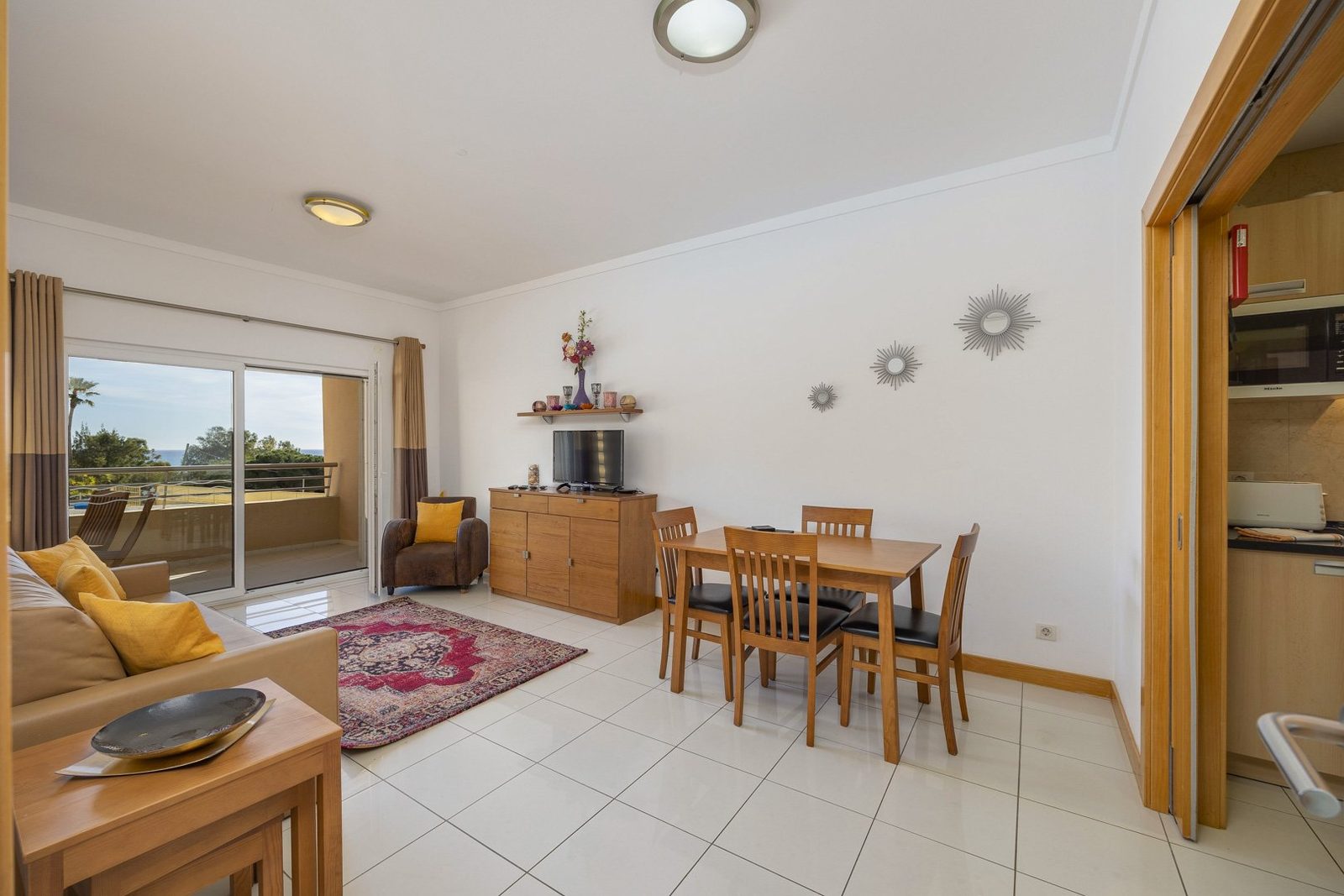 Dining area with view through to the living room and kitchen