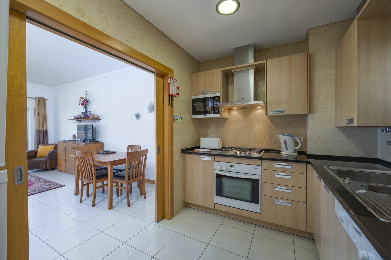 Kitchen with view through to the dining and living area