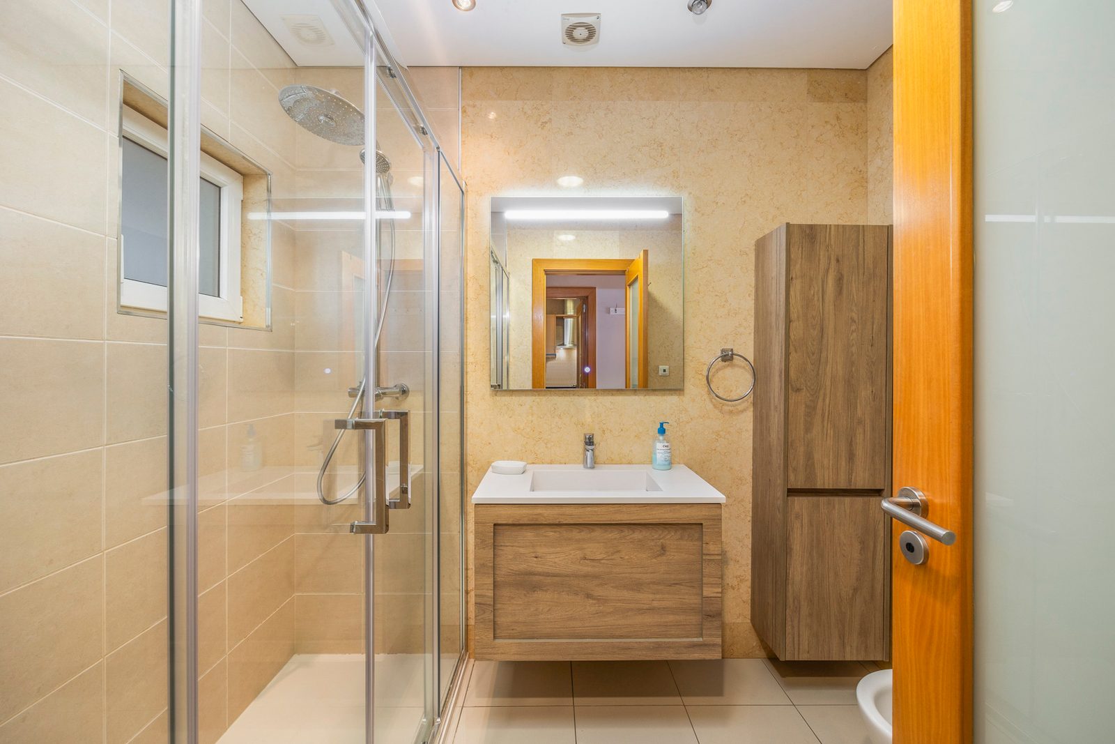 Bathroom with walk-in rain shower and vanity sink