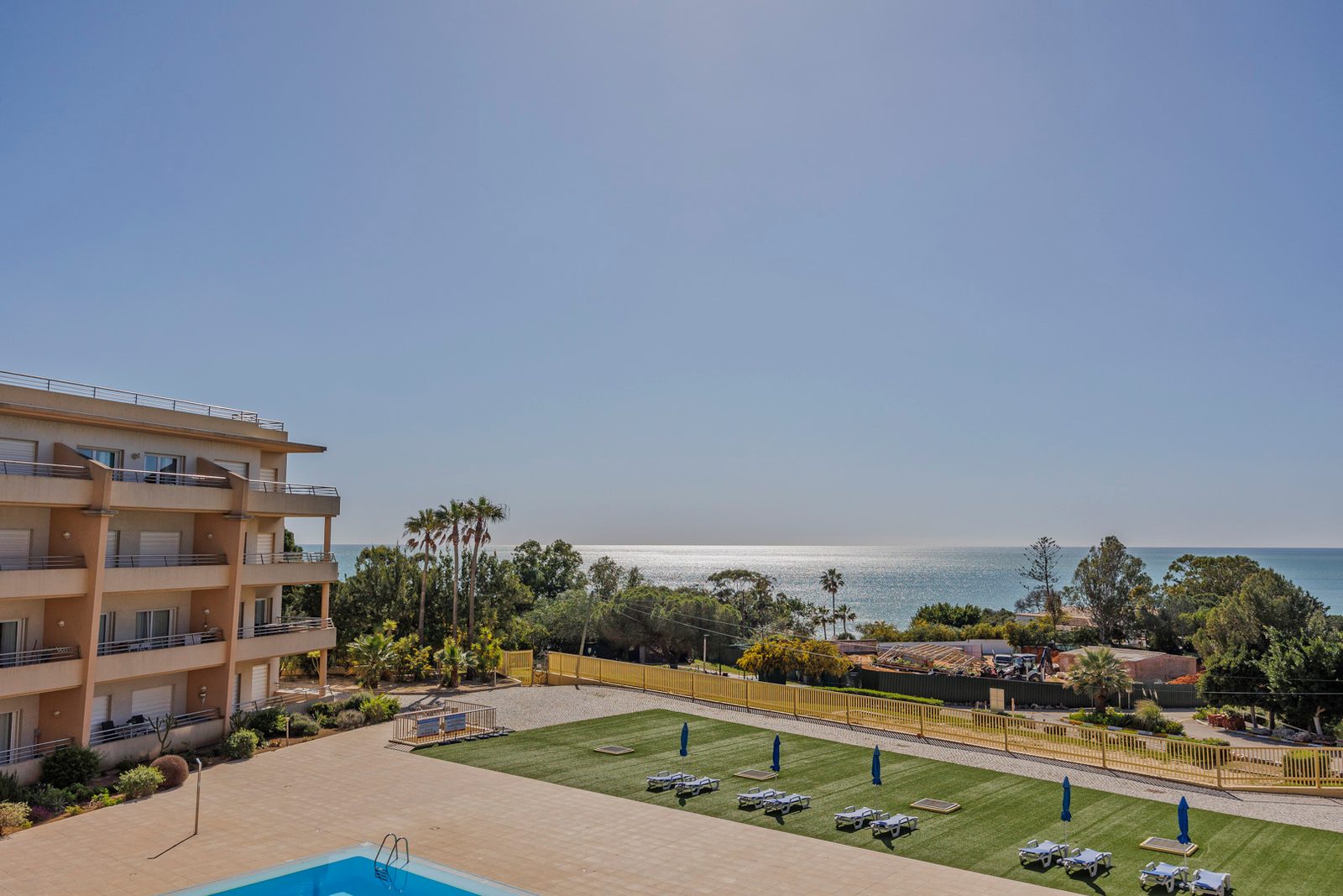 Sea view over the sun lawn and gardens from the balcony