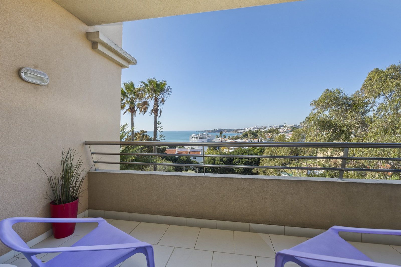 Balcony with lounge chairs and coastal view