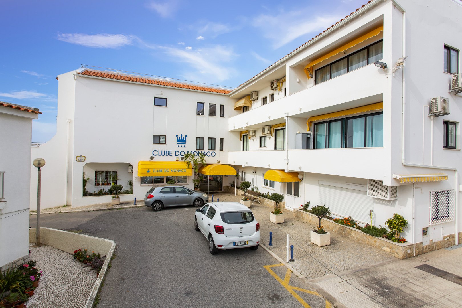 Building exterior with signage and parking area