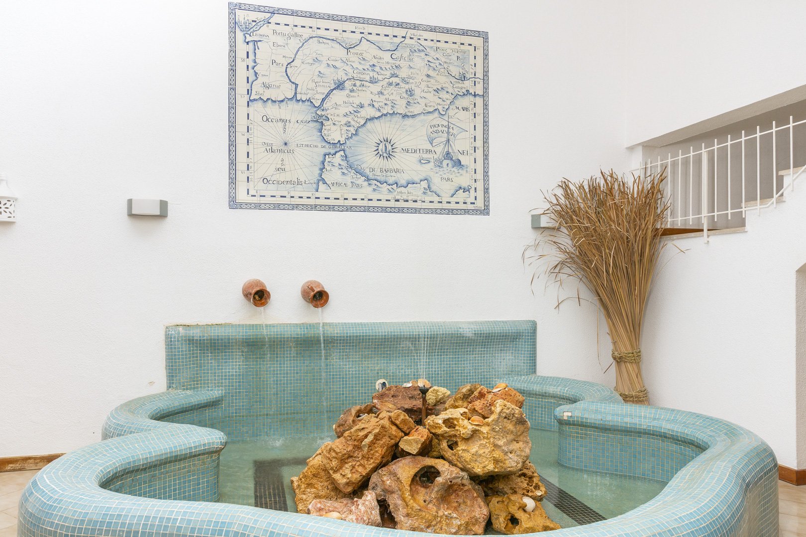 Close-up of the decorative tiled fountain feature in the communal lounge