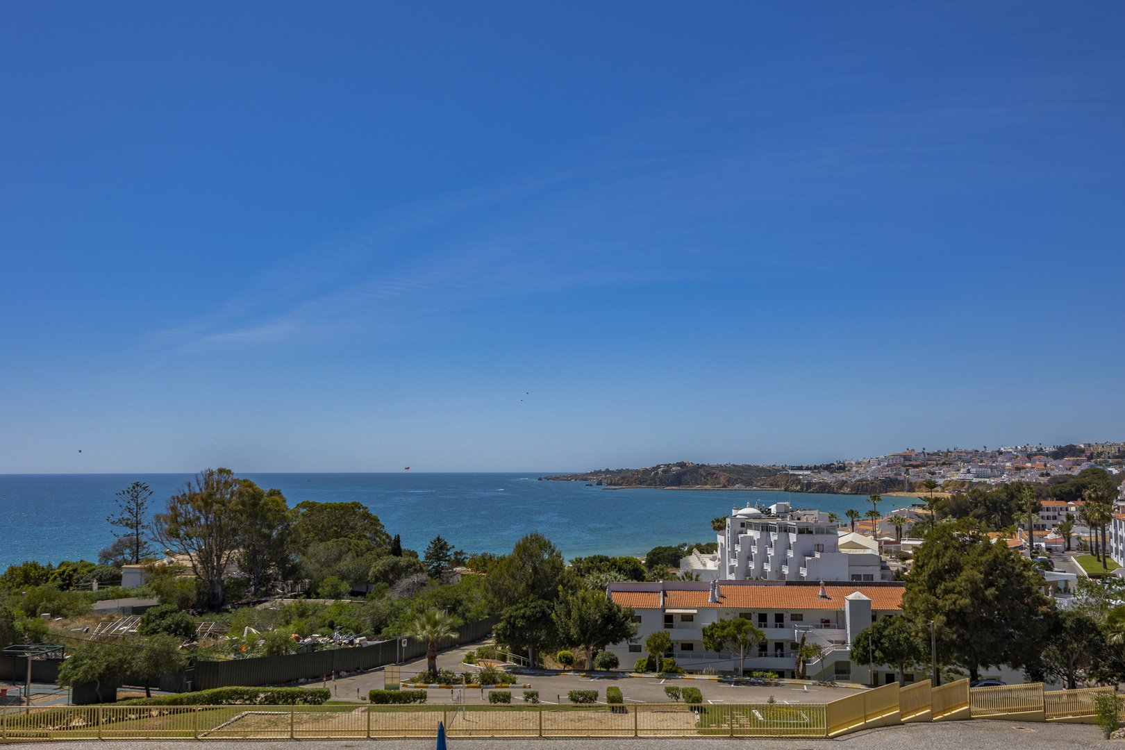 Elevated panoramic view of the sea and coastal town