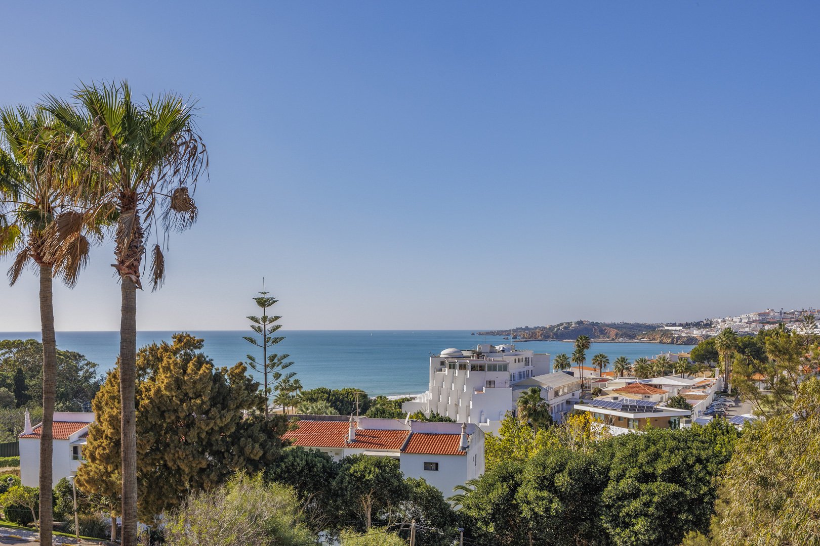 Hilltop panorama of the coastline, beach, and town