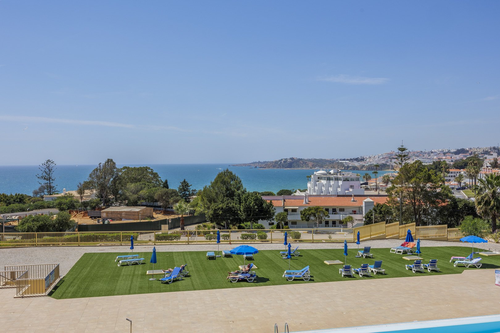 Elevated view over the sun lawn, sea, and coastline