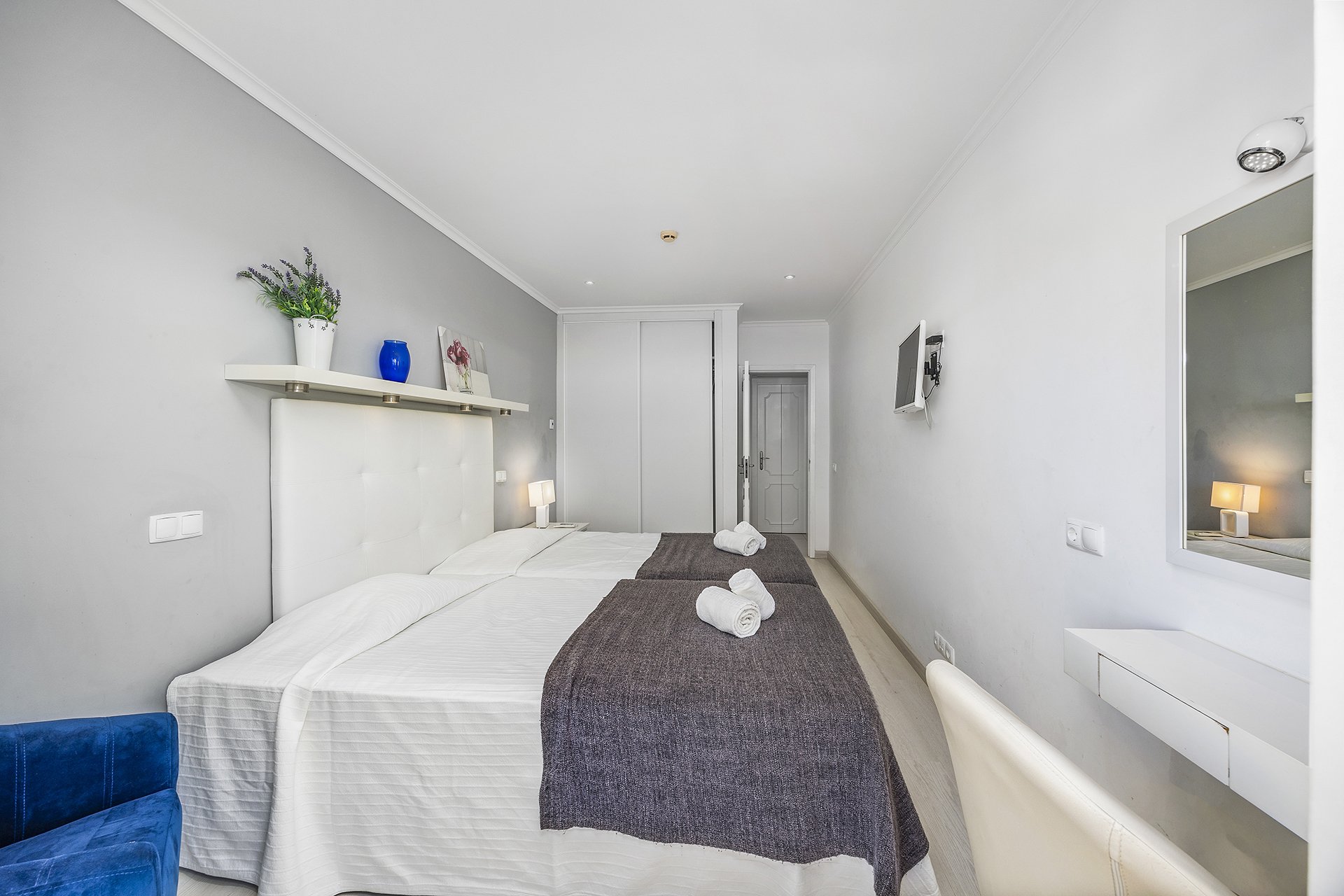 Bedroom with twin beds and wardrobe