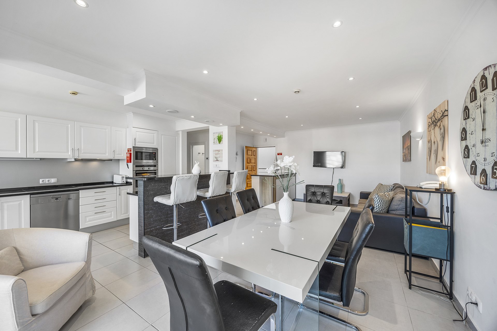 Dining table with kitchen and lounge area
