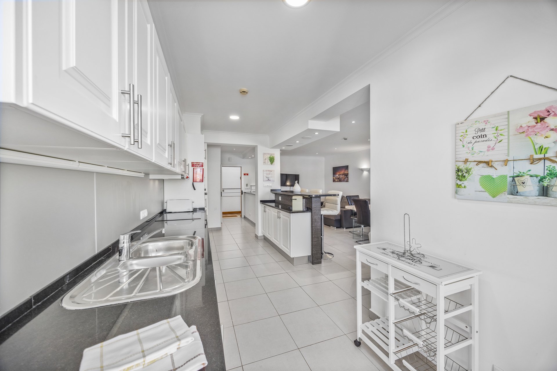 Kitchen hallway leading to the living and dining area