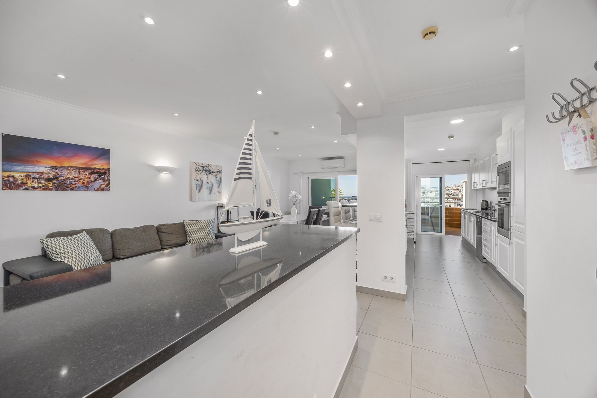 Open-plan living area with kitchen and dining bar
