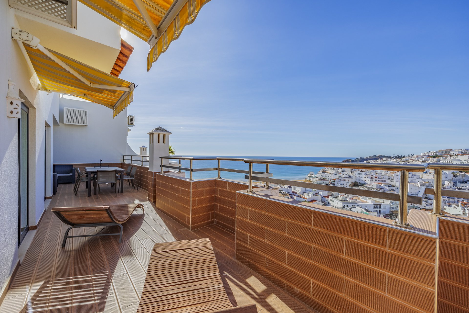 Terrace with sun loungers and sea view