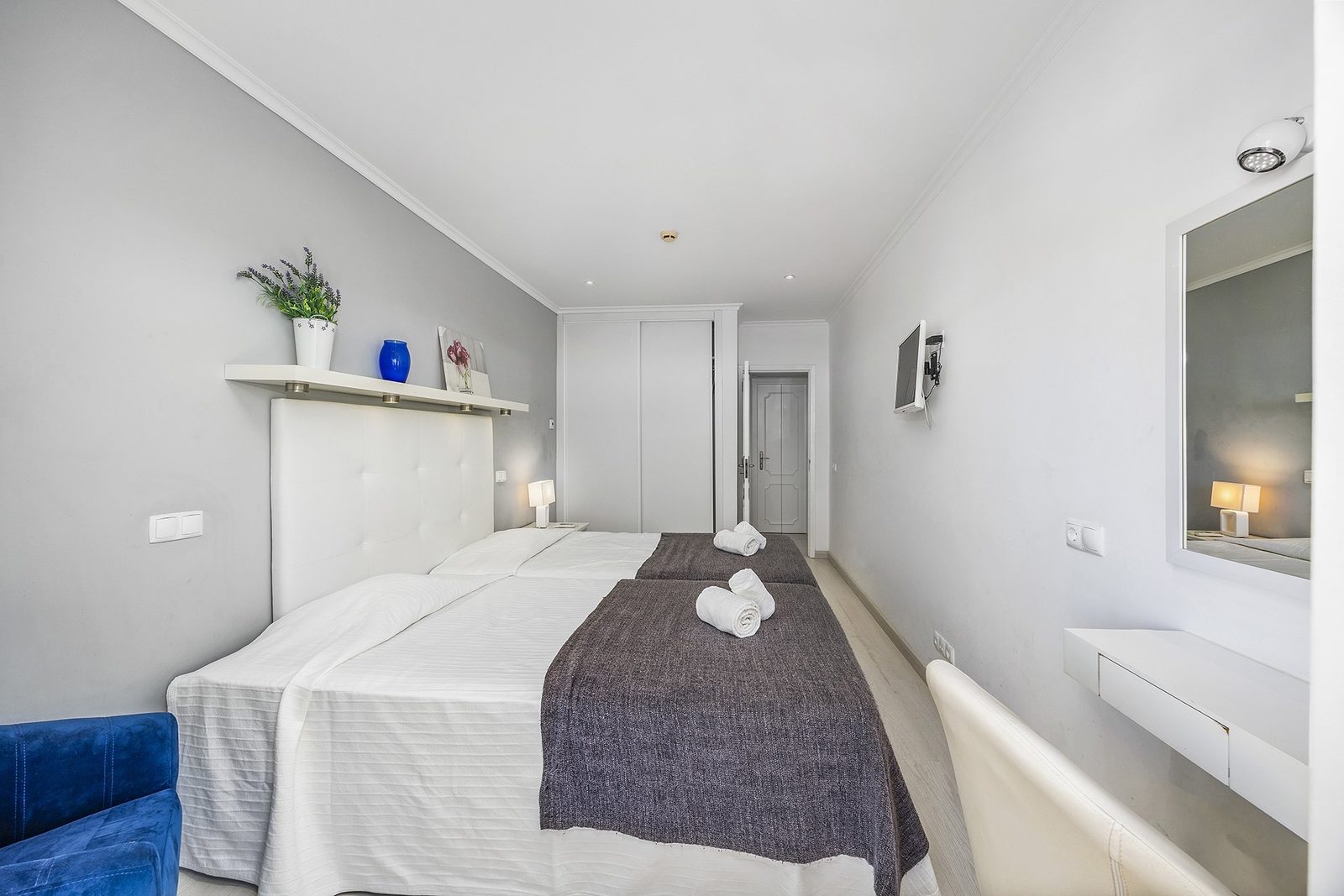 Bedroom with twin beds and wardrobe