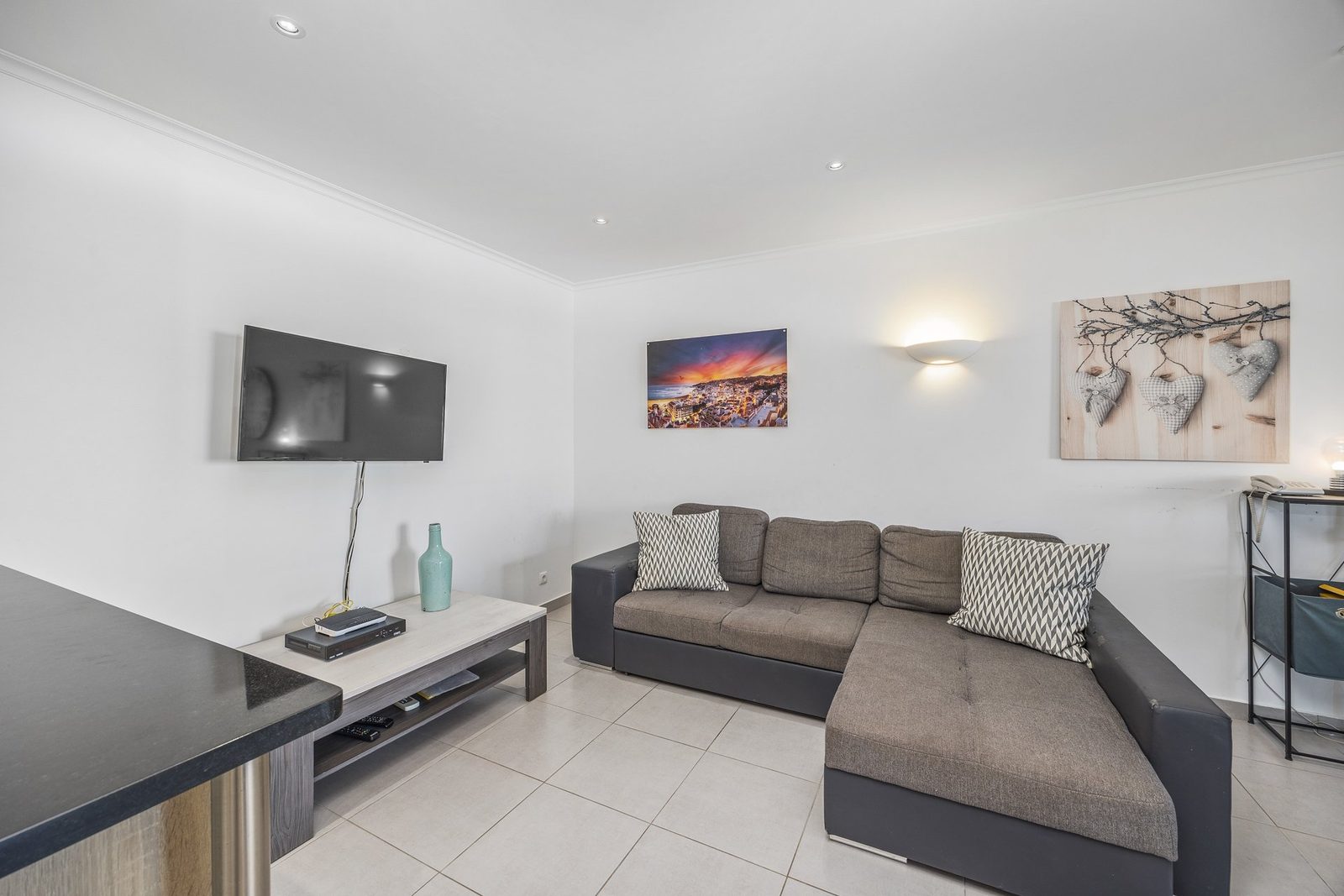 Living room with corner sofa and TV