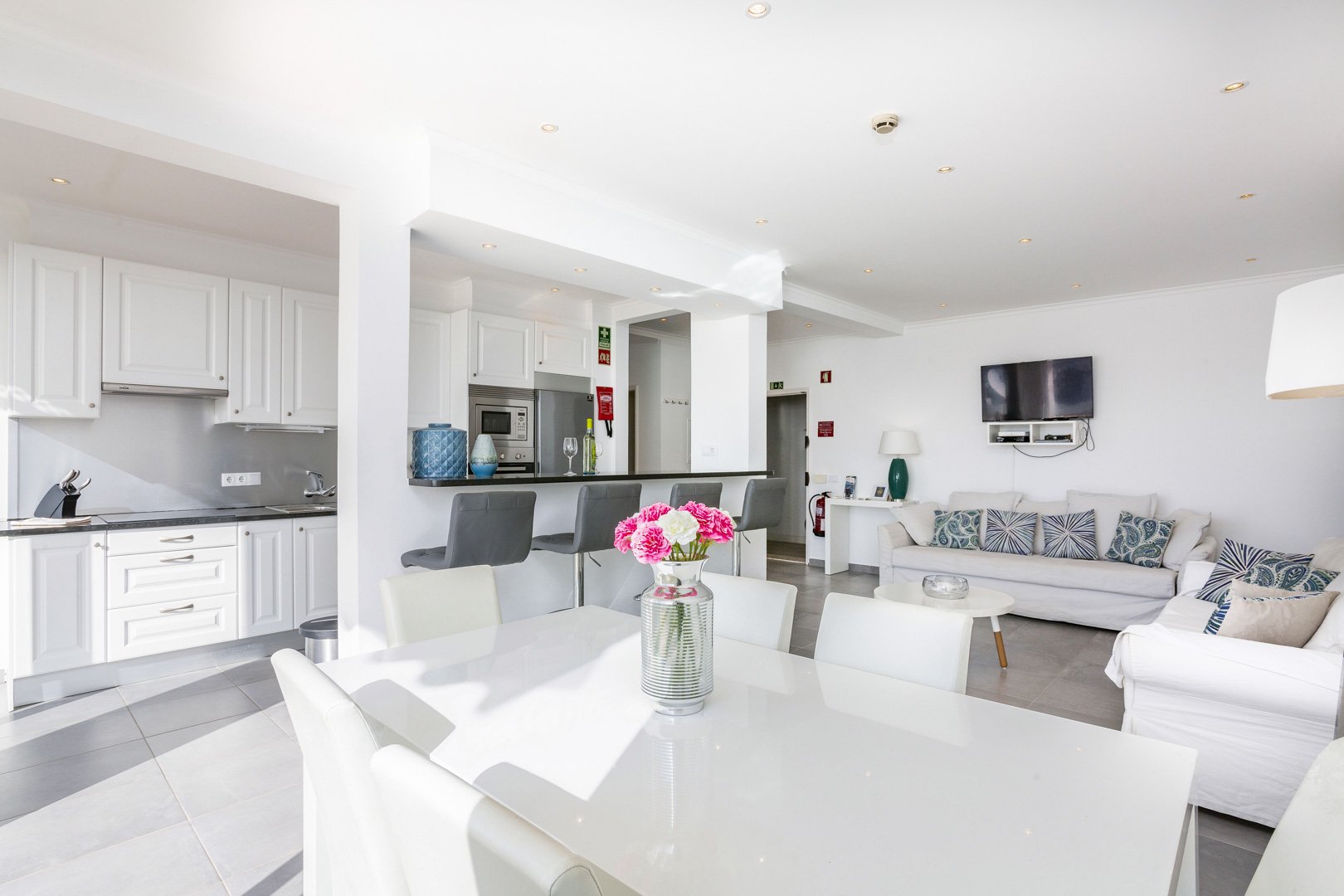 Dining table with kitchen and living room