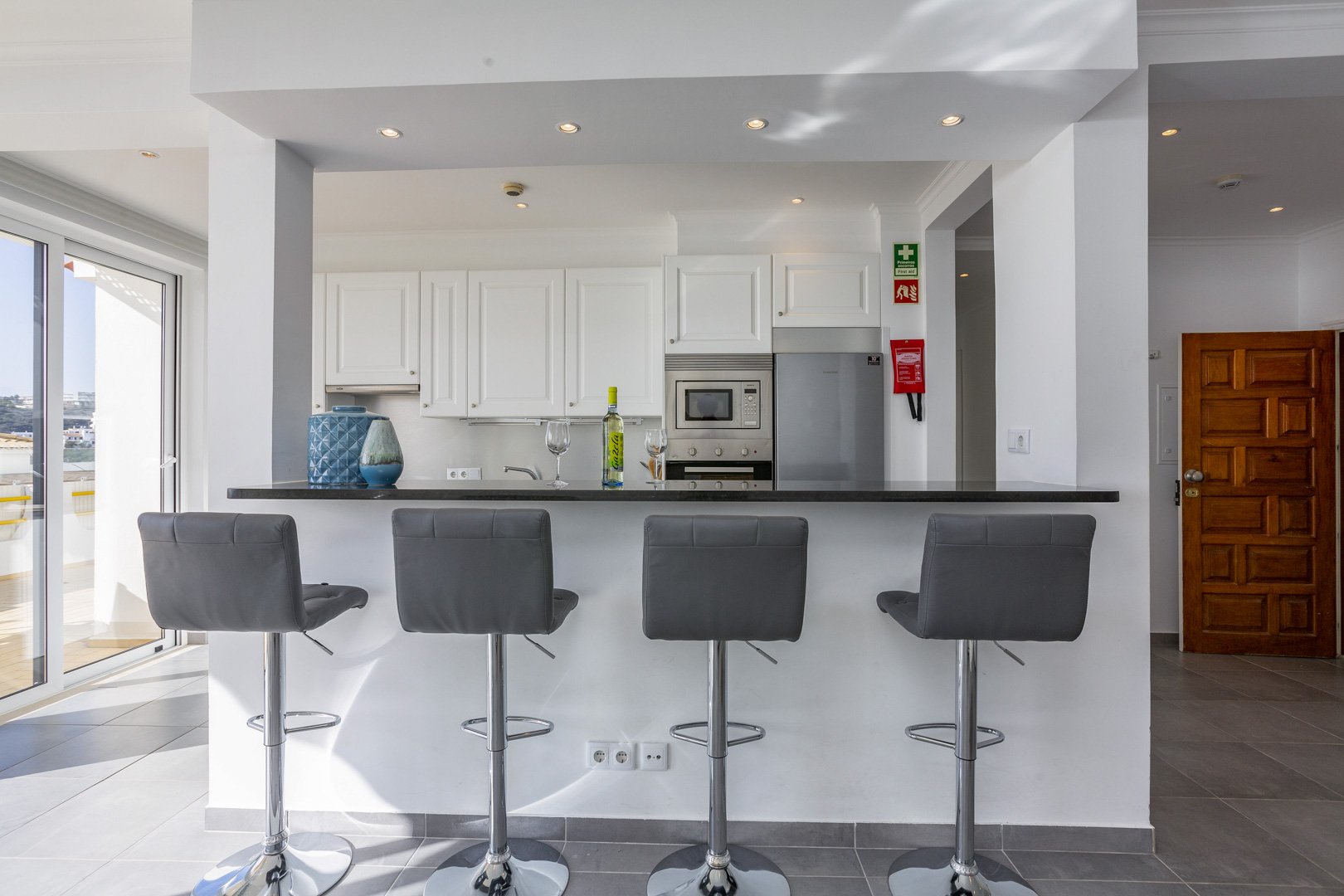 Kitchen with breakfast bar and stools