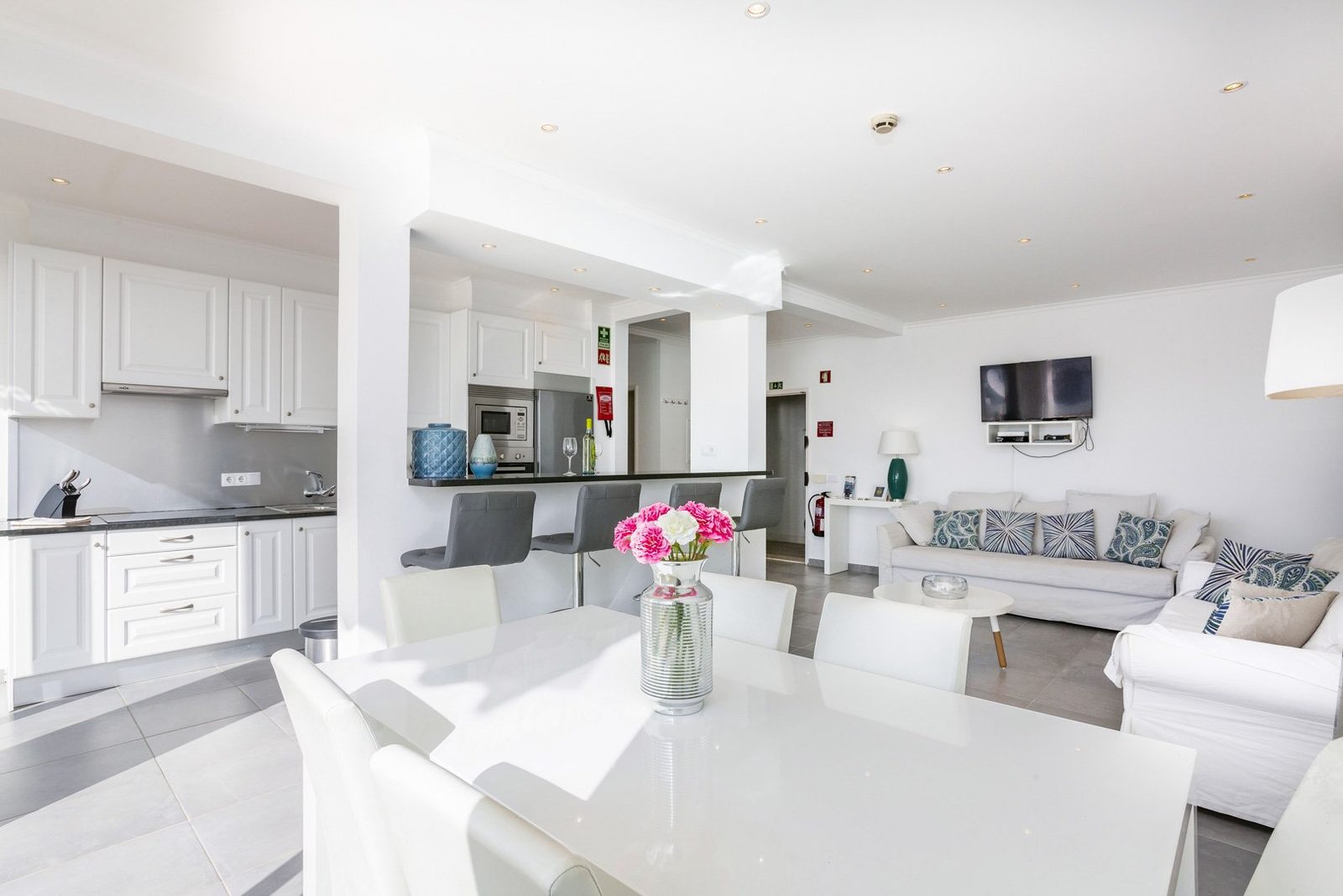Dining table with kitchen and living room