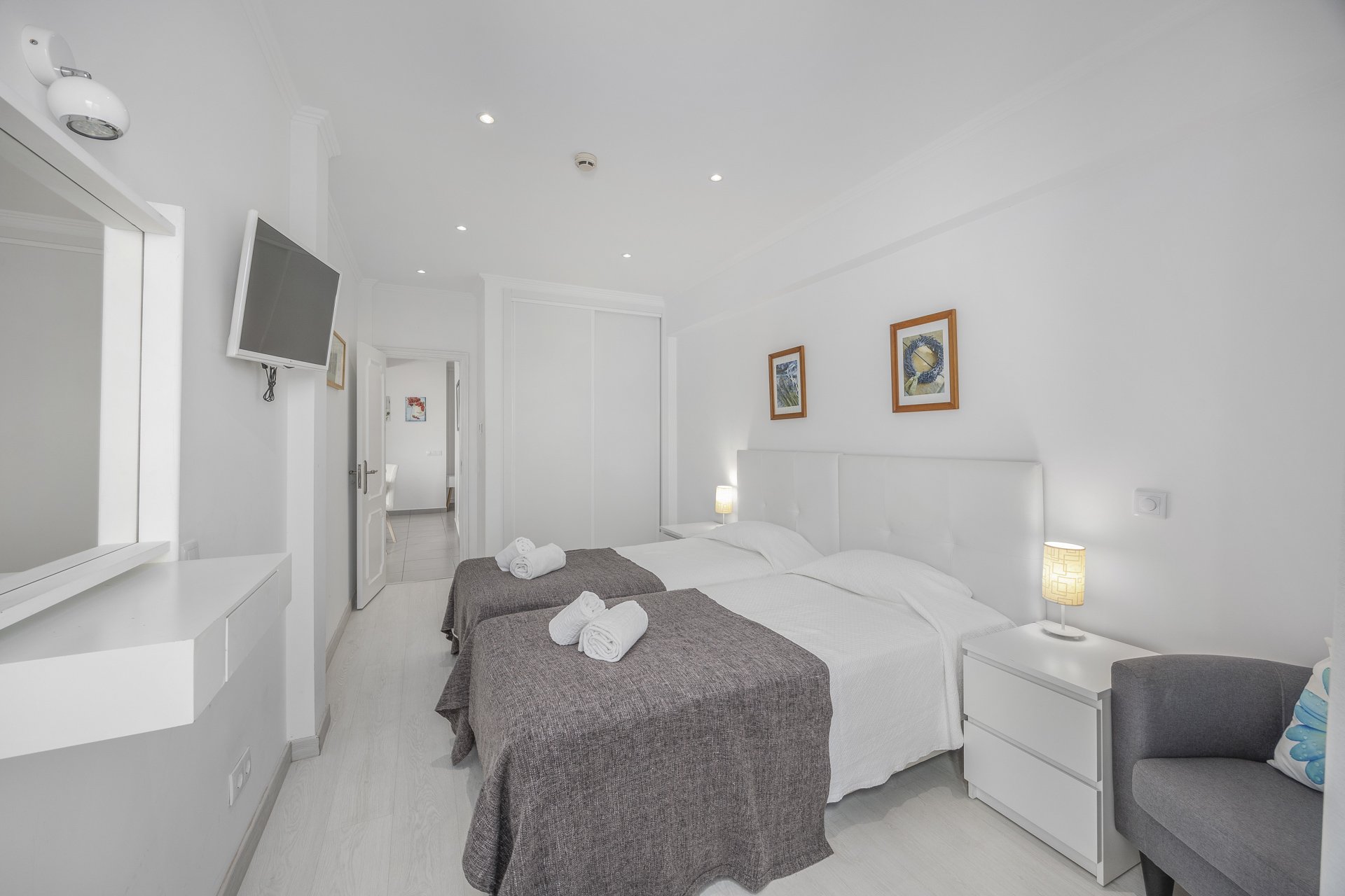 Bedroom with balcony access and town view, alternate view
