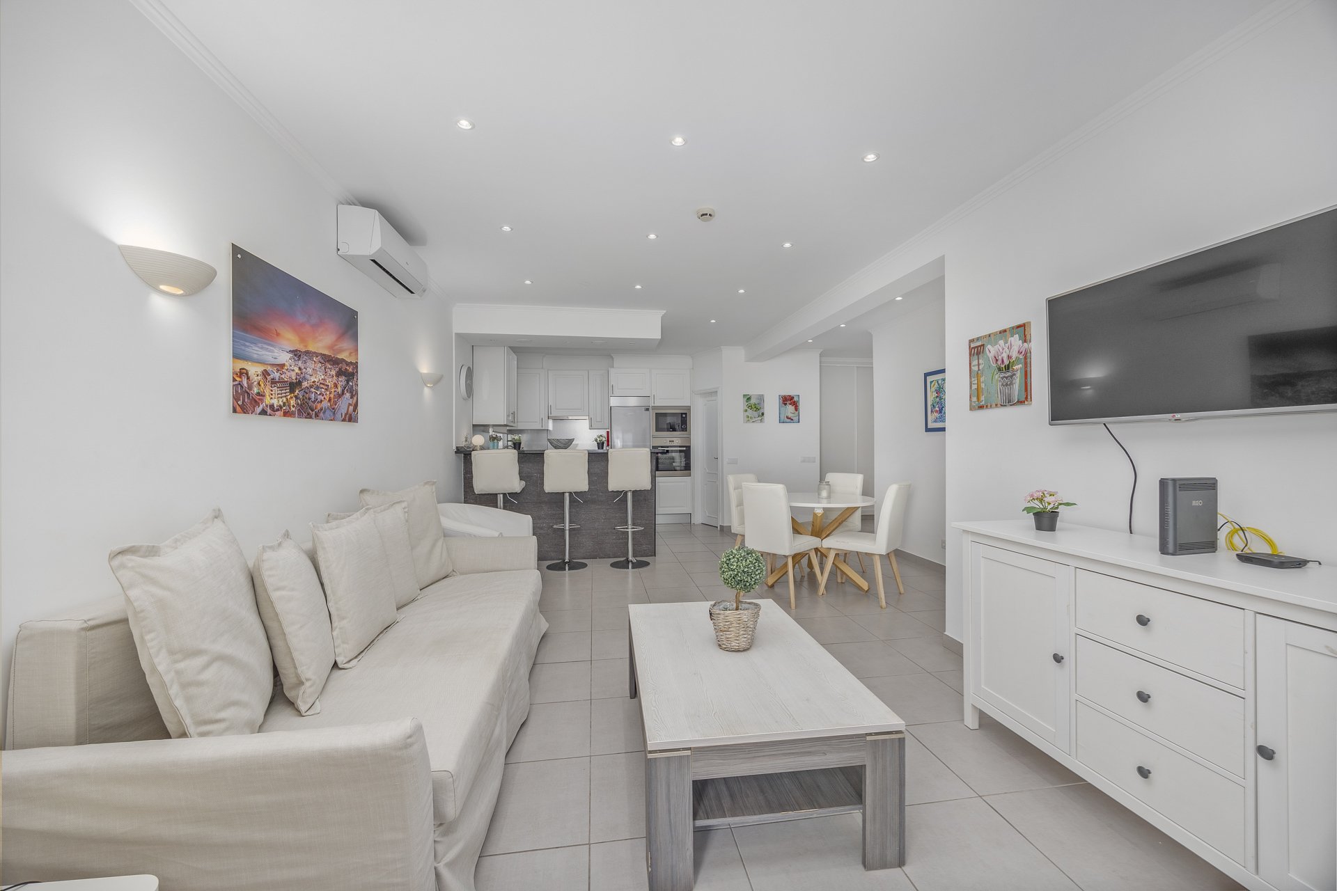 Open-plan living area with kitchen bar, alternate view