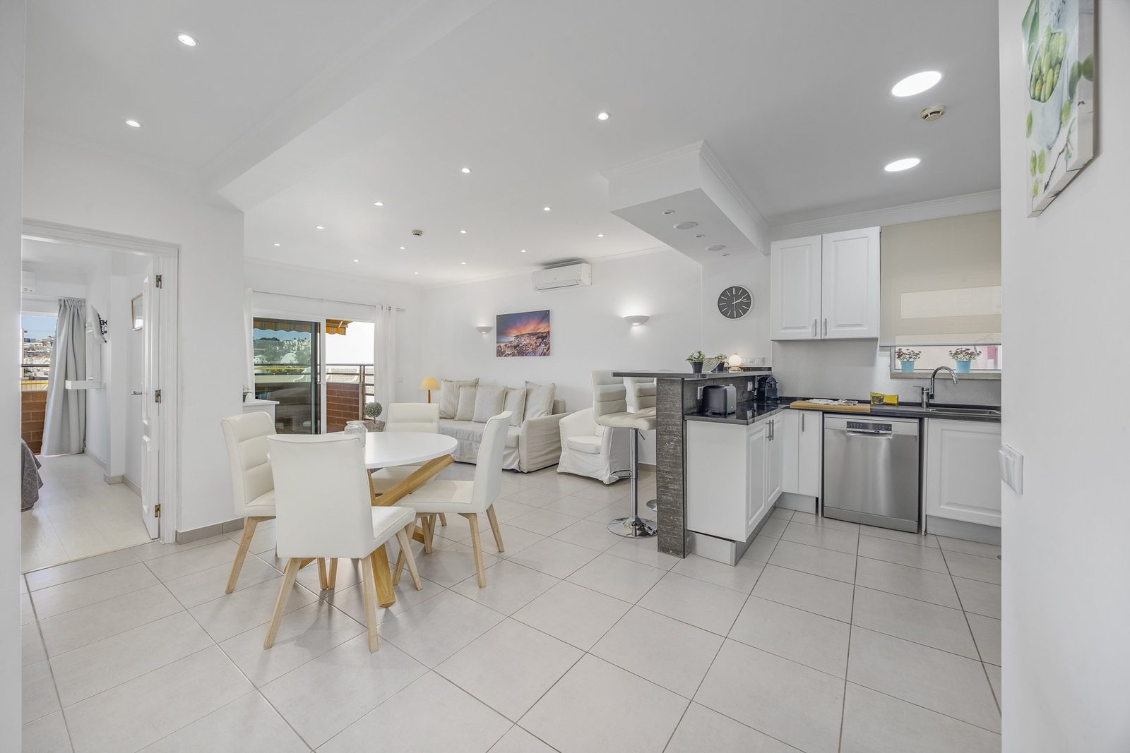 Dining area with round table and living room