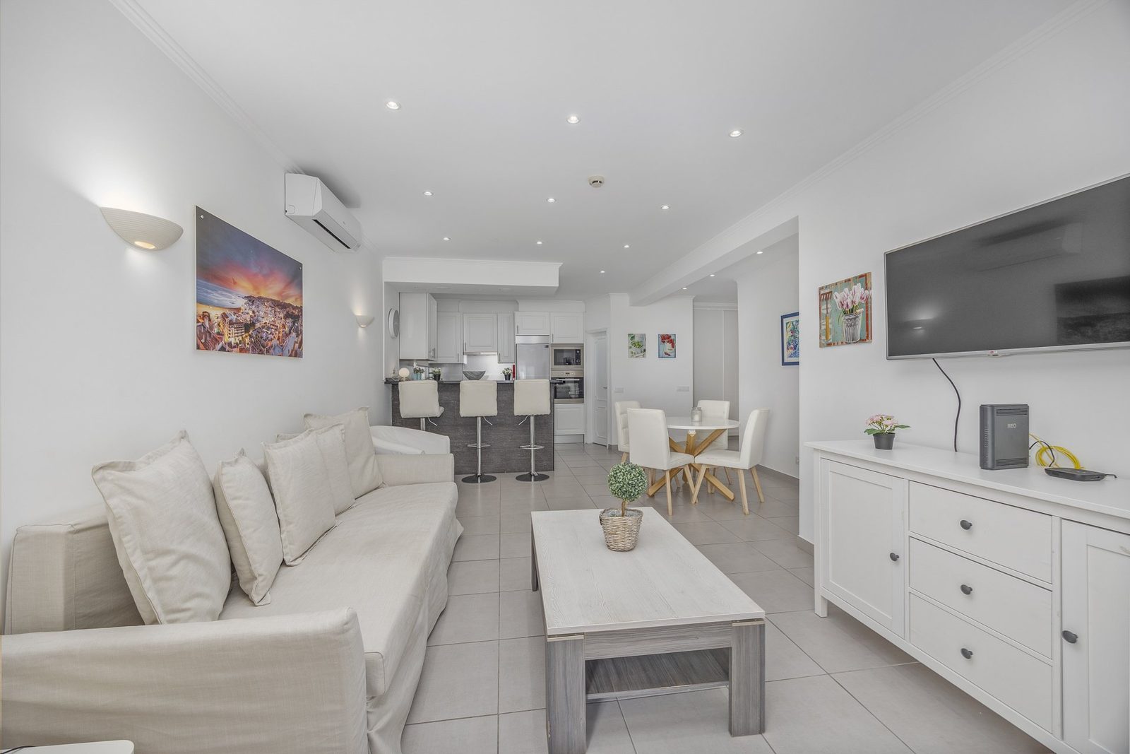 Open-plan living area with kitchen bar, alternate view