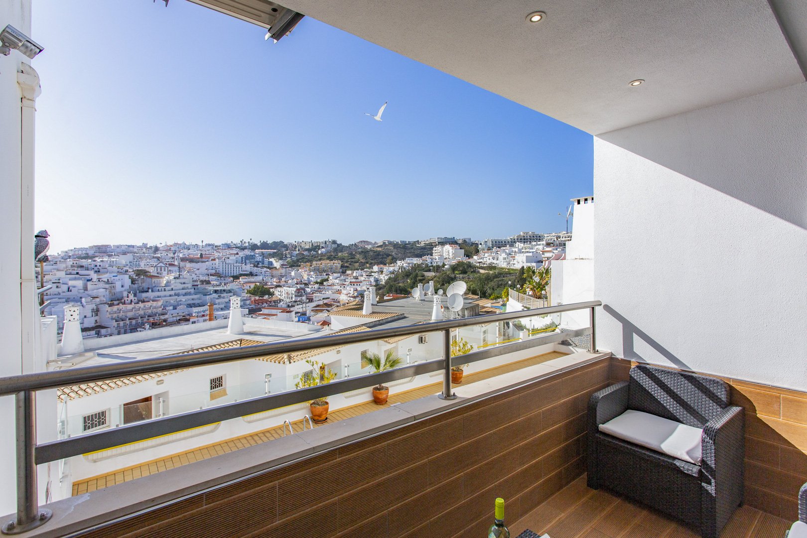 Balcony seating area with panoramic town view