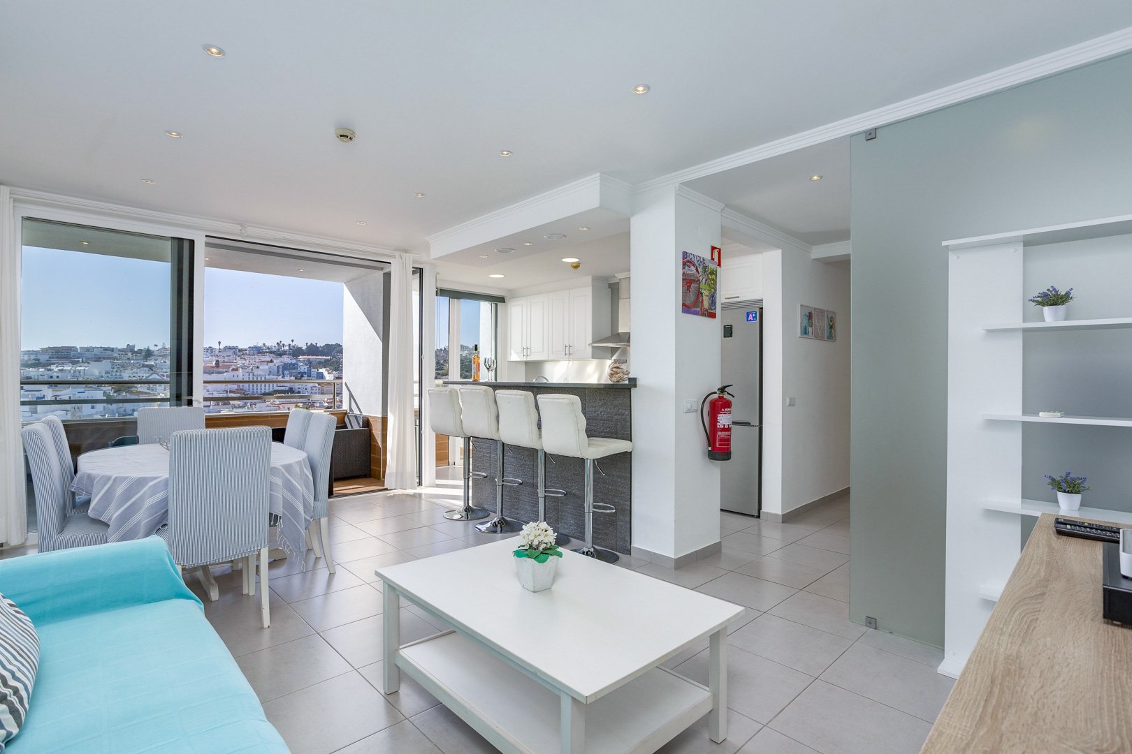 Open-plan living area with kitchen breakfast bar, alternate view